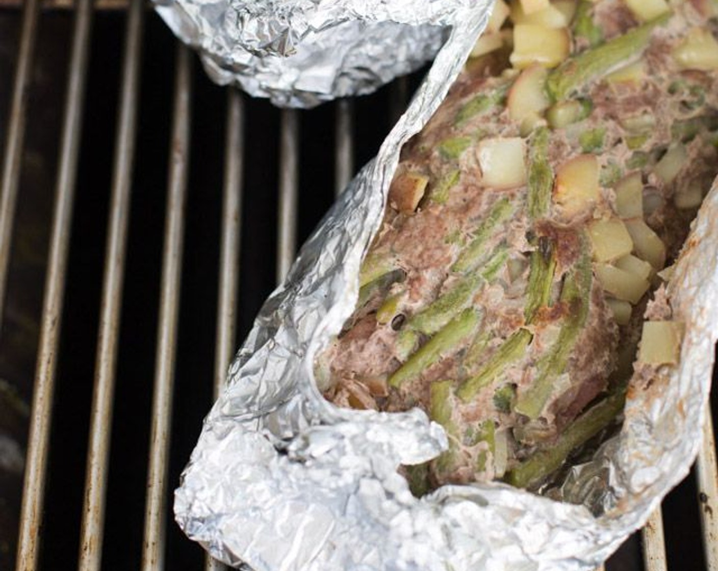 step 6 Place packs on a grill or campfire at 250-300 degrees F (121-148 degrees C) and cook until meat is done and potatoes are soft ( about 30 minutes), flipping packs on the other side halfway through cooking.