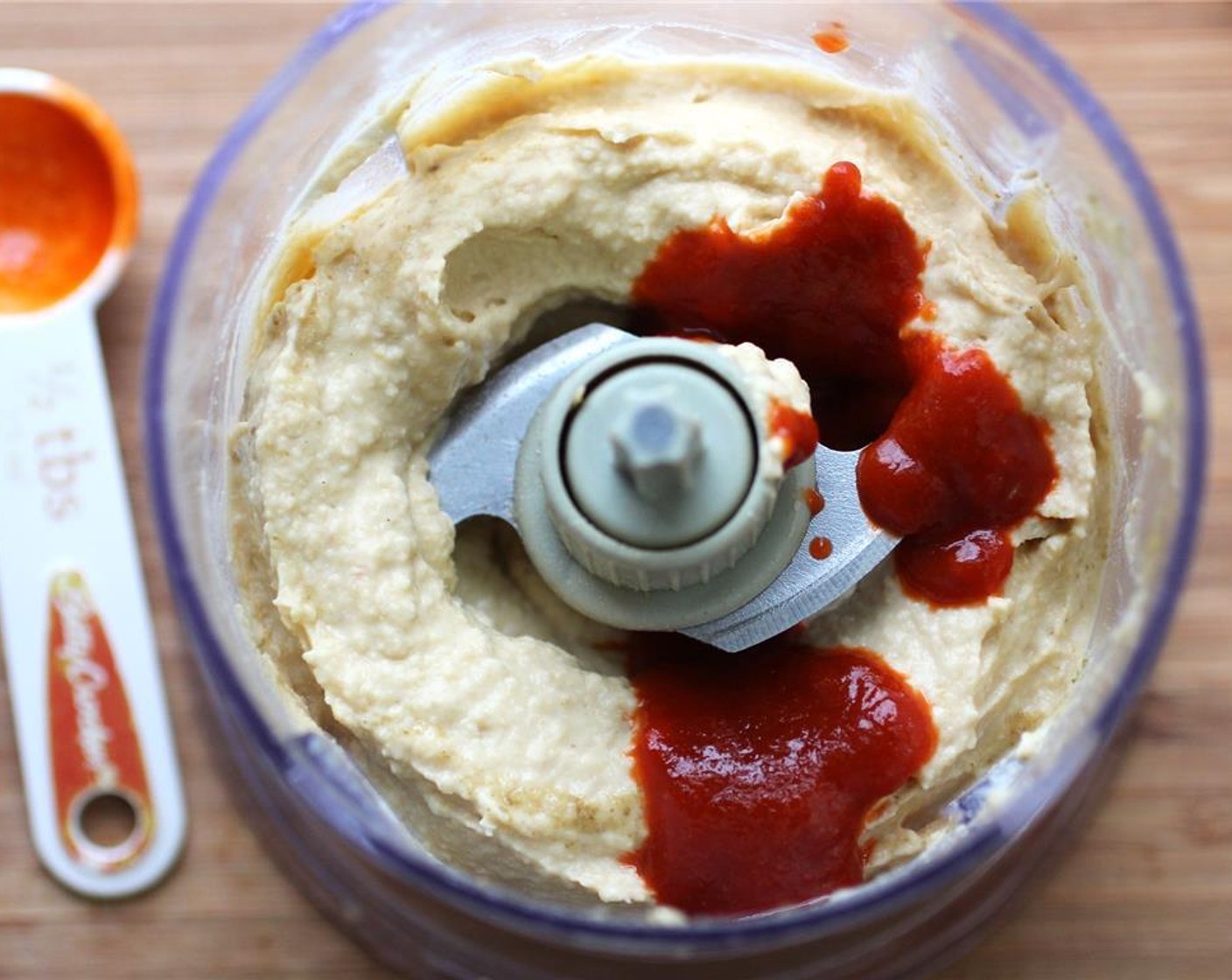 step 3 Blend until smooth. Add Sriracha (1 Tbsp), 1/2 tbsp at a time to the food processor, taste testing as you go.