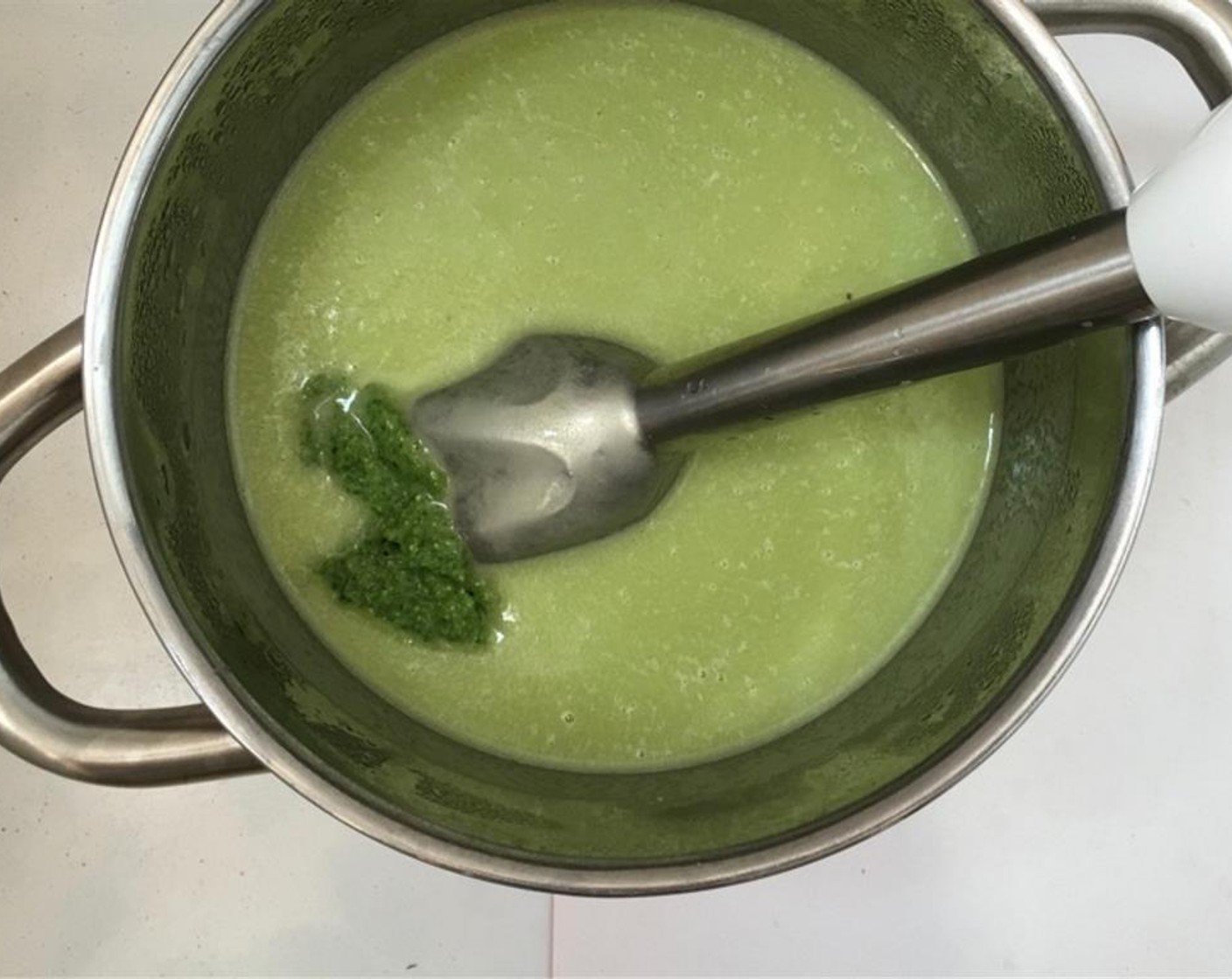 step 5 Blend or mix the soup into a smooth mixture. Add the Basil Pesto (3 Tbsp).
