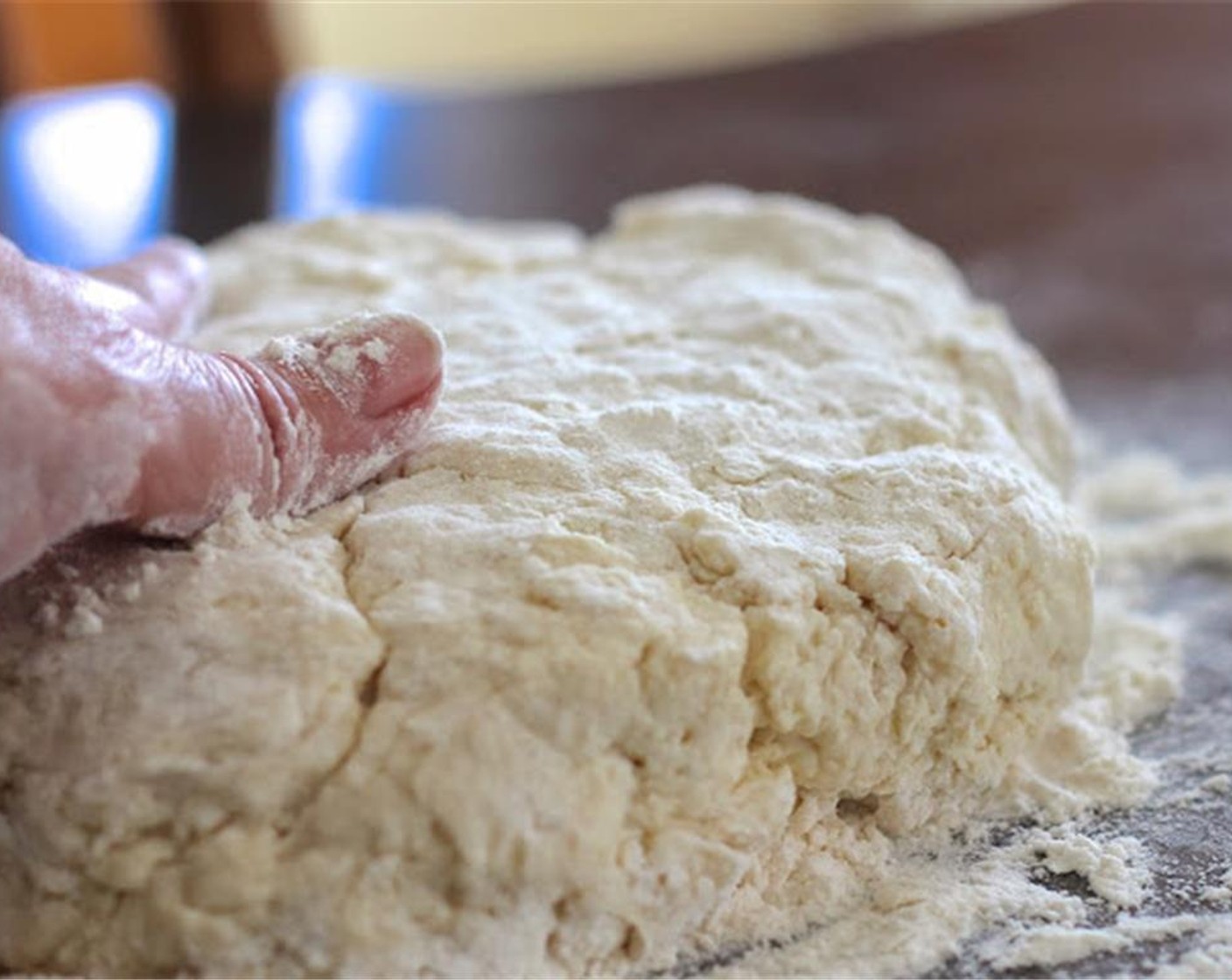 step 5 Turn the dough onto a floured surface and pat it out with floured hands. Pat it out to about 1 to 1 1/2 inches thick. It is important not to make your biscuits too thin. You want them to rise up nicely.
