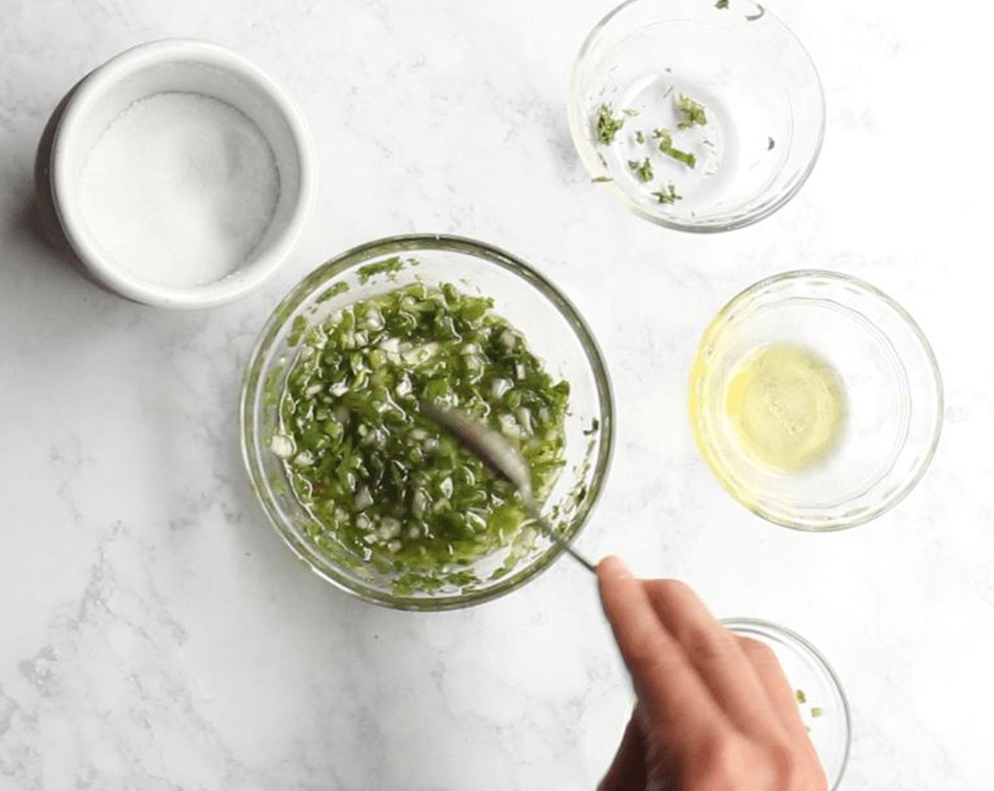 step 9 In a separate small bowl, combine the Fresh Cilantro (4 Tbsp), Jalapeño Pepper (1 Tbsp), Scallions (2 Tbsp), Olive Oil (4 Tbsp), and Salt (to taste).