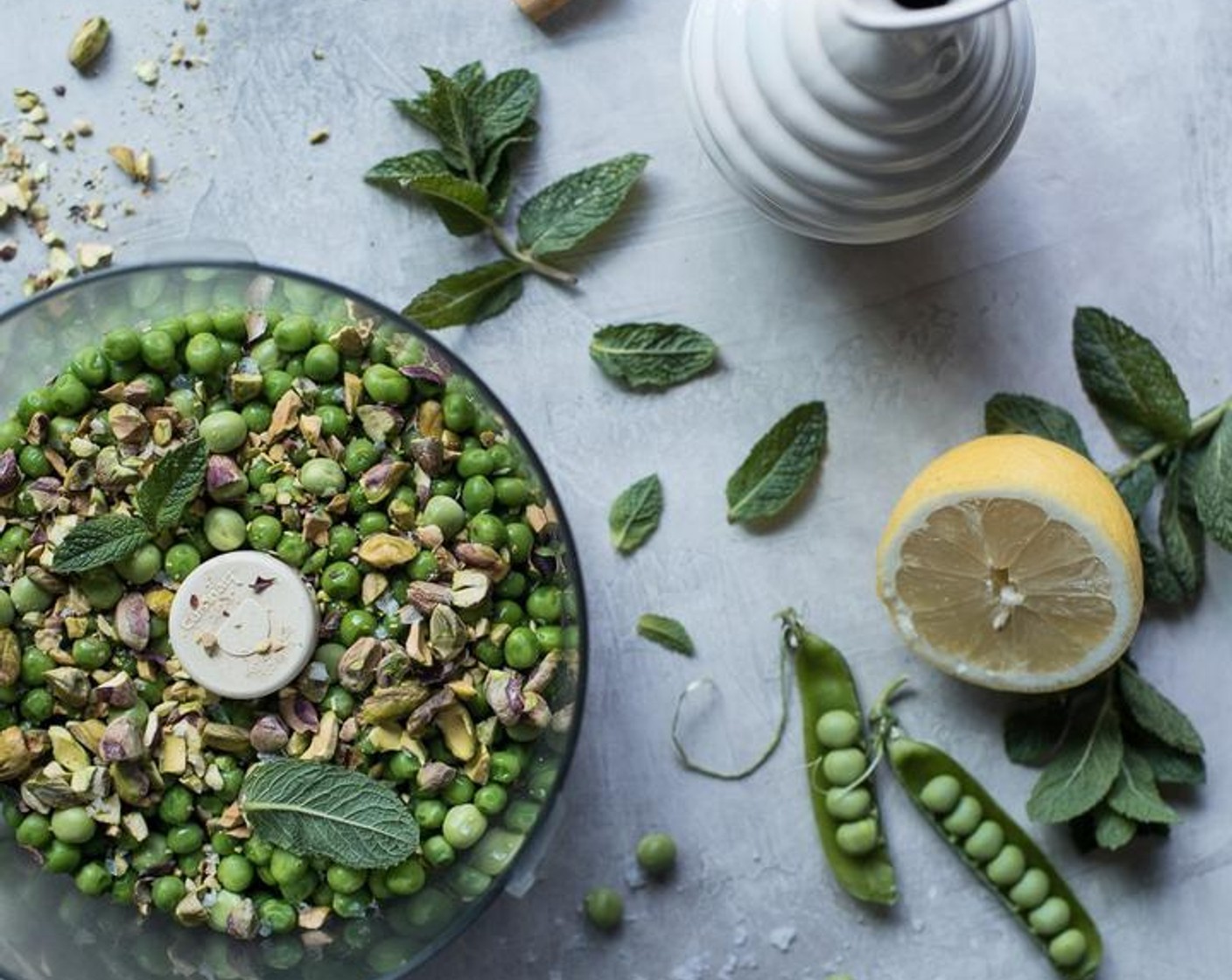 step 3 Add the chilled peas, Fresh Mint Leaves (1/4 cup), zest from the Lemon (1/2) and Parmesan Cheese (1/4 cup) (if omitting parmesan add a generous pinch of salt) - pulse in the food processor until ingredients are well combined, but not smooth.