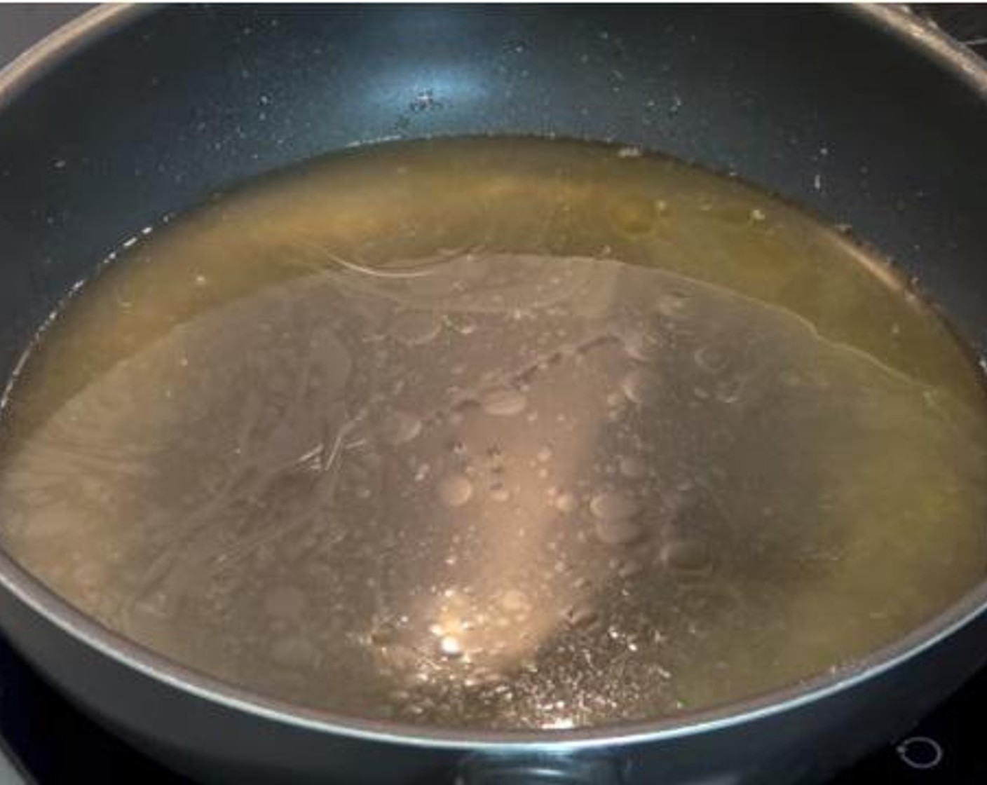 step 3 In the same pan, simmer the Chicken Stock (2 cups).