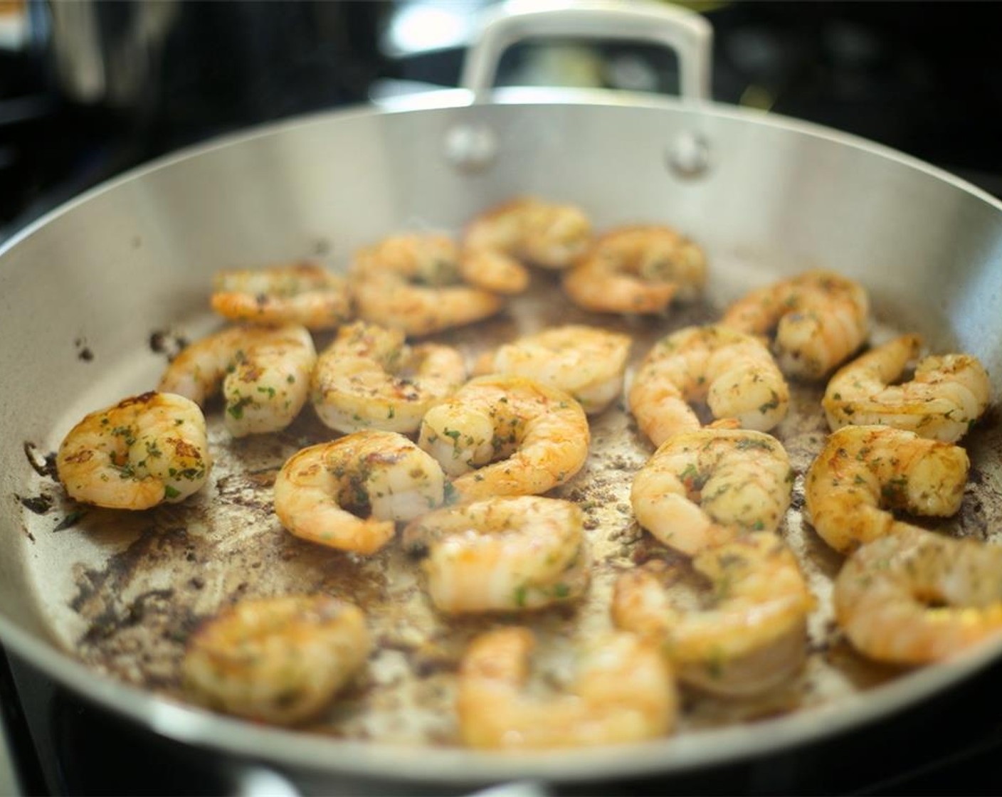 step 16 Once oil is hot, using tongs, carefully add the shrimp to the pan in a single layer. Cook one minute on both sides, and remove shrimp.