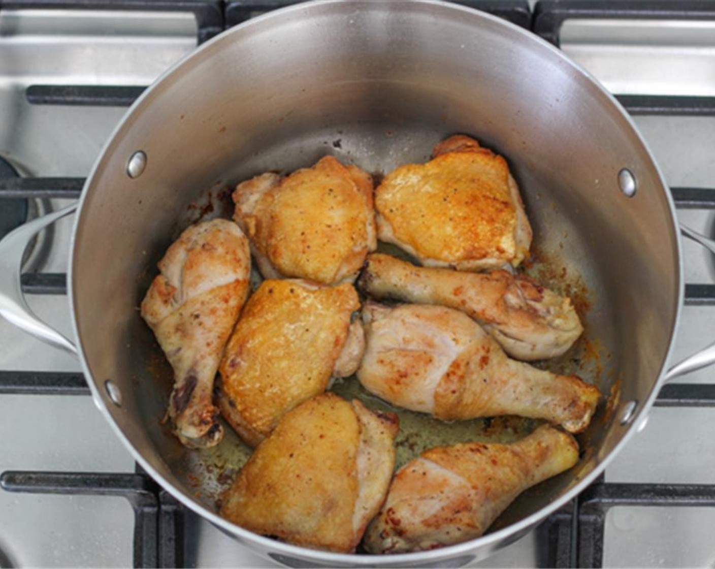 step 3 Heat the Oil (1 Tbsp) on high heat until smoking hot in a large and deep skillet or dutch oven. Brown the chicken on both sides really well until golden brown, about 5-8 minutes on both sides.