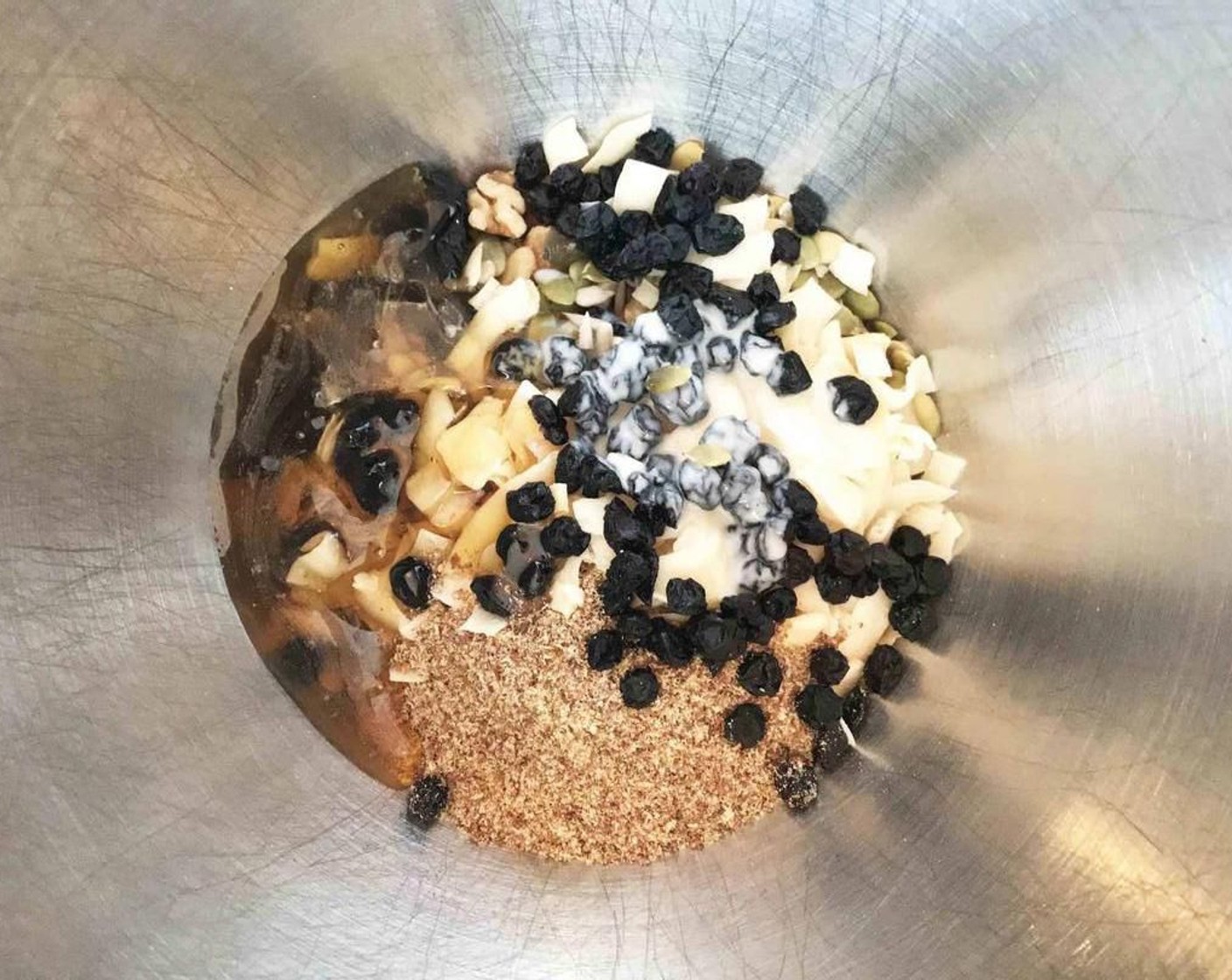 step 2 Place Raw Cashews (1/2 cup), Raw Walnuts (1/2 cup), Coconut Chips (1/2 cup), Pepitas (1/3 cup), Raw Sunflower Seeds (1/3 cup), Flaxseed Meal (1/4 cup), Dried Blueberries (1/4 cup), {@10:}, Coconut Butter (1 Tbsp), Chia Seeds (1/2 tsp), and Vanilla Extract (1/2 tsp) a large bowl.