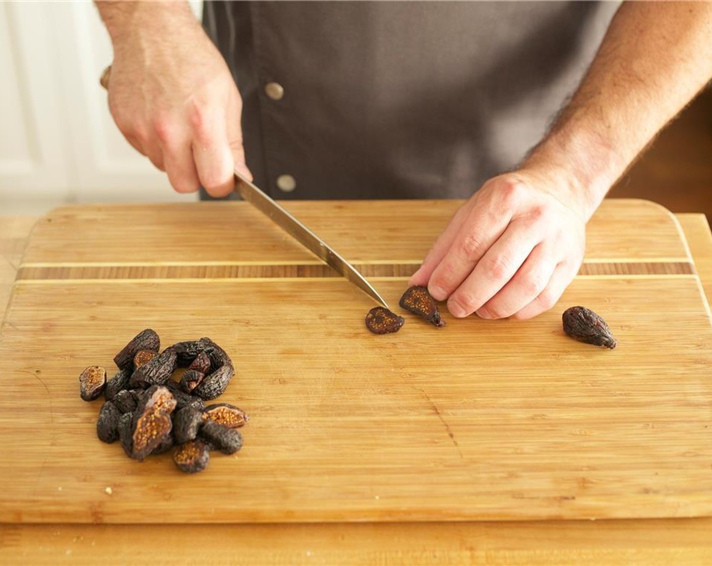 step 7 Carefully, slice the Dried Figs (12) lengthwise into two even halves. Set aside.