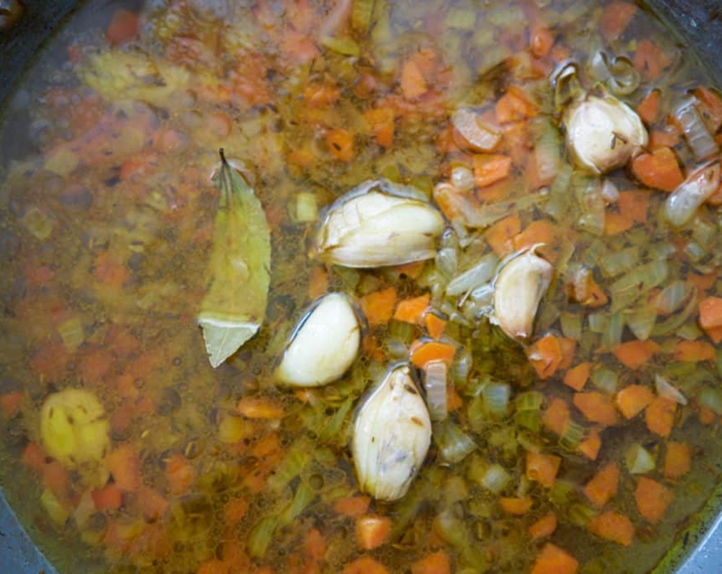 step 6 Add the Sherry Vinegar (2/3 cup), Water (1/2 cup), Bay Leaf (1), and bring mixture to a boil. Reduce the heat and simmer about 1 minute.