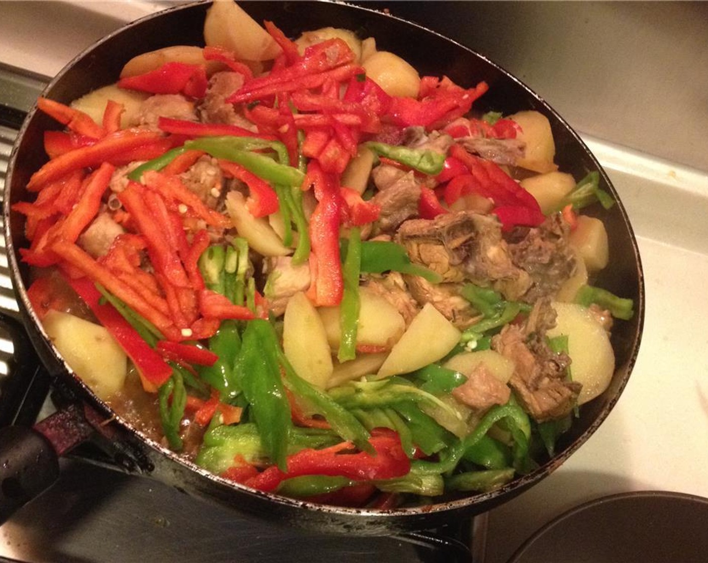 step 9 Add the sliced bell peppers and cook over high heat. Add Salt (to taste) and Ground Black Pepper (to taste) and stew under high heat to evaporate the liquid.