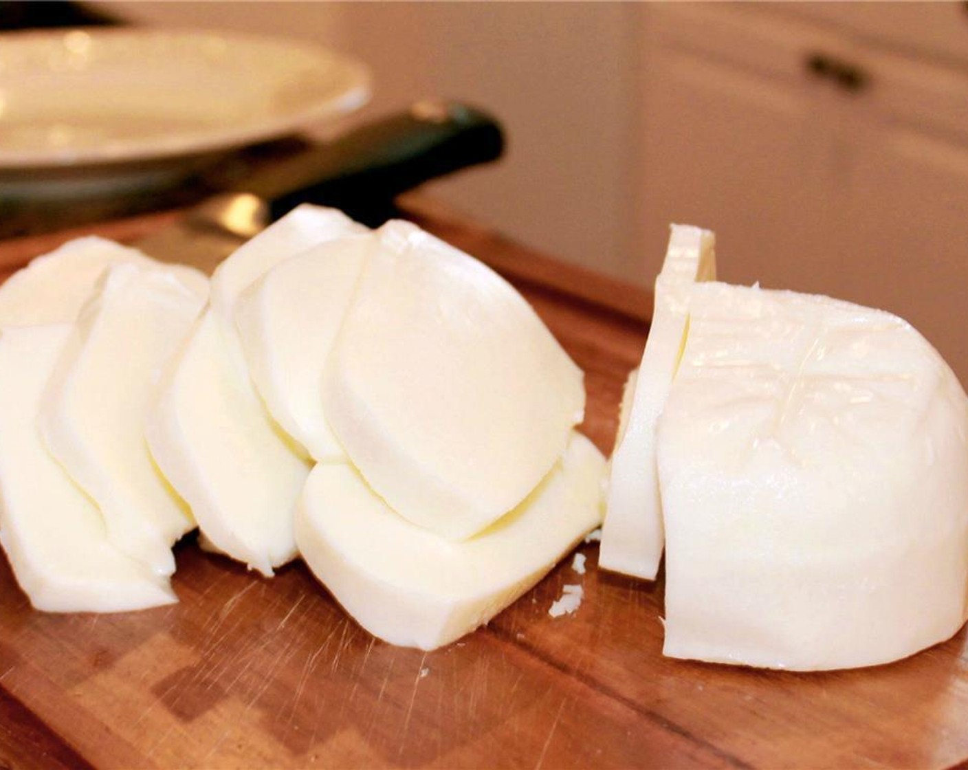 step 6 Slice the Low-Moisture Mozzarella (2 cups) and set aside.