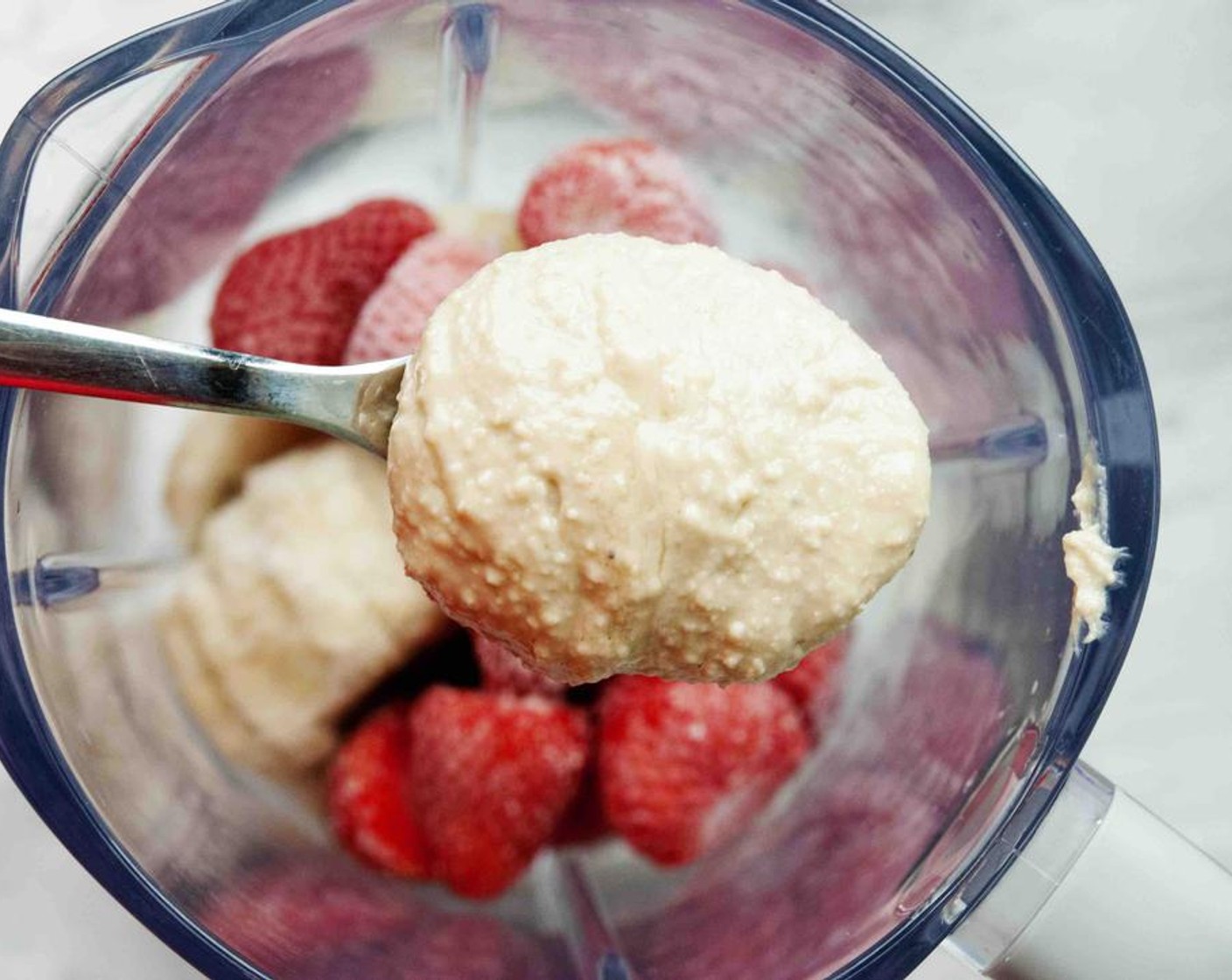 step 2 Add Cashew Butter (1/4 cup) to your blender. This will make the nice cream extra creamy.