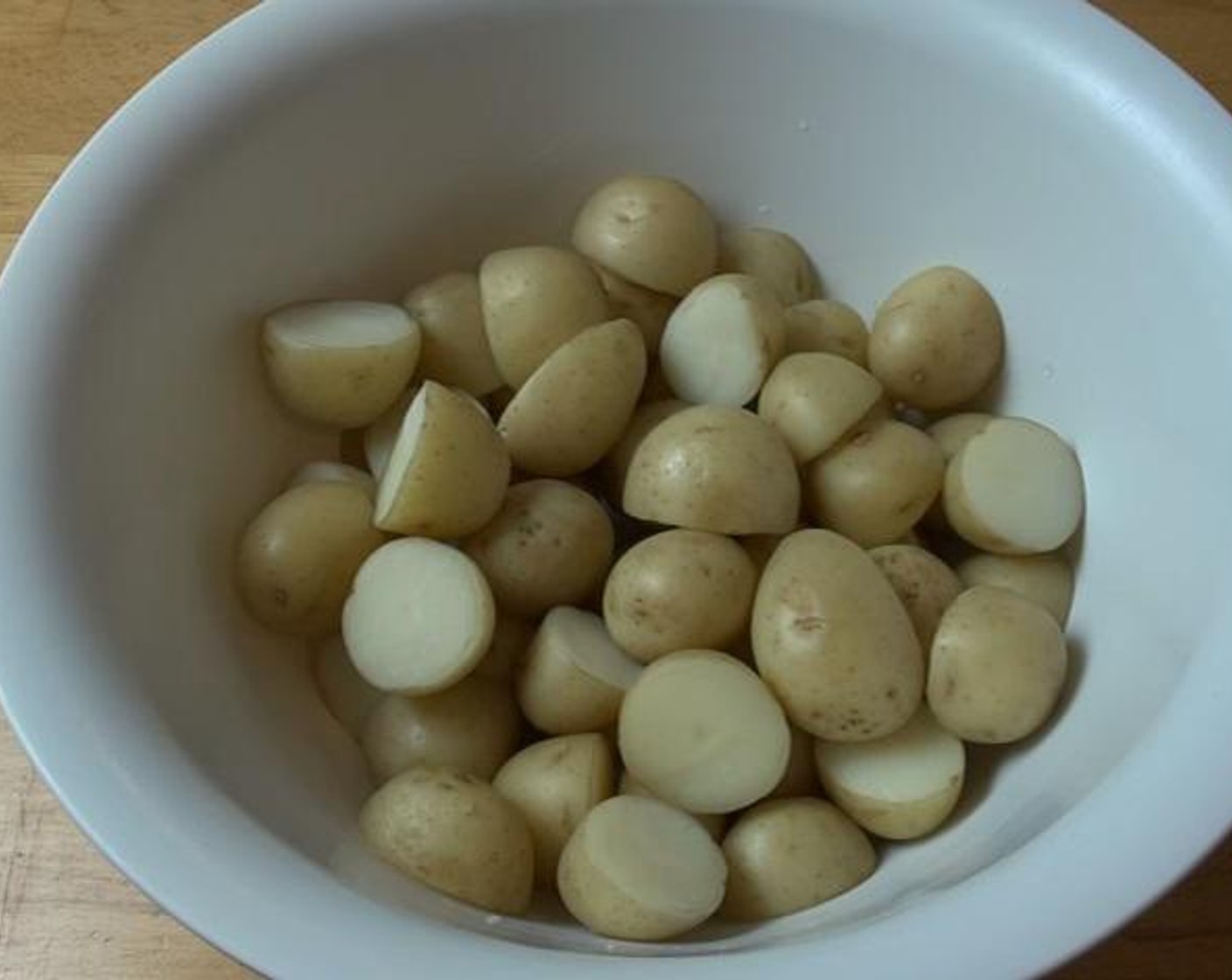 step 1 Wash and cut in half the Baby Potatoes (3.3 lb). Boil them for about 10 minutes or until they are tender. Chill the potatoes for about 1 hour before making the dressing.