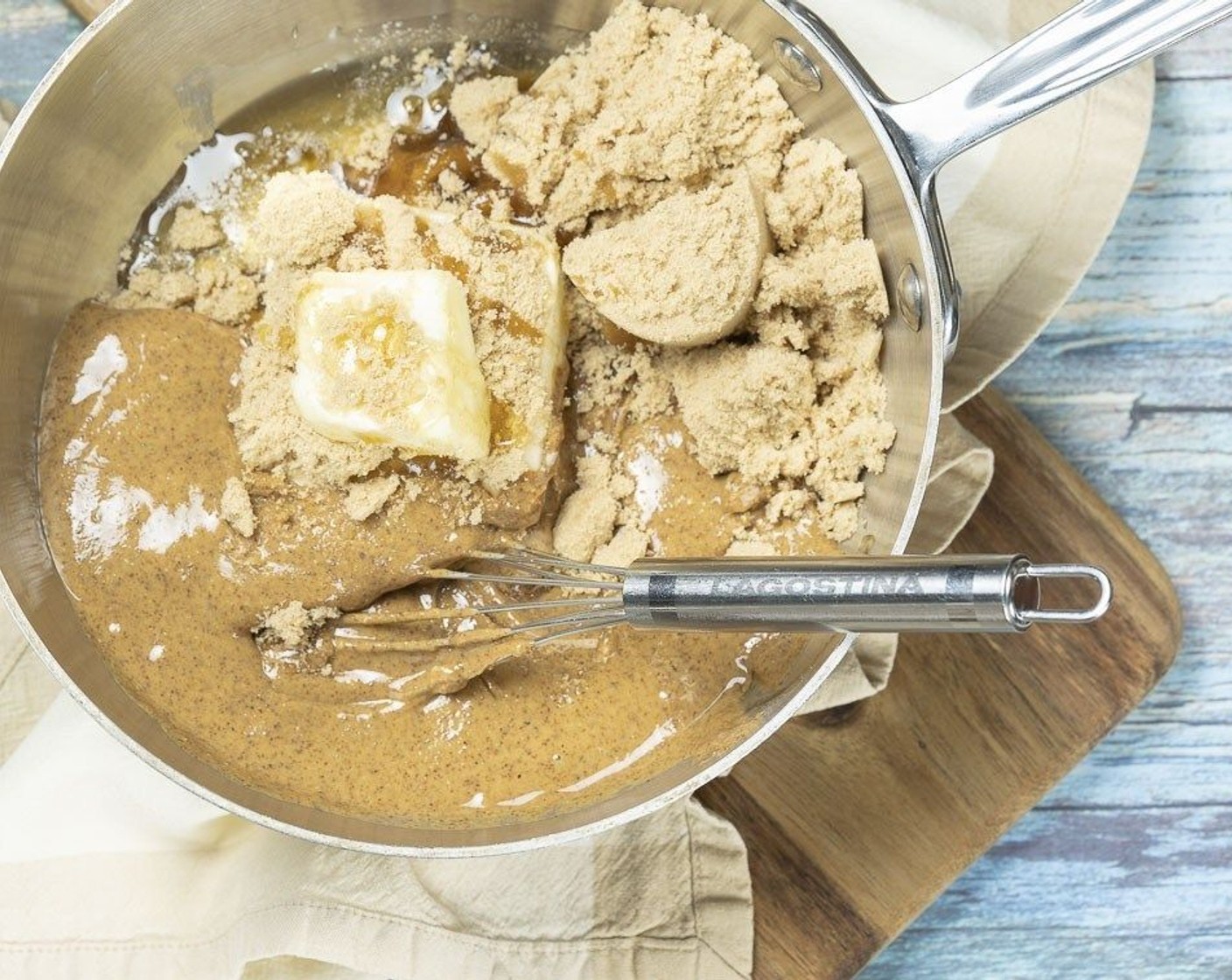 step 1 In a medium size pot over low/medium heat stir together Almond Butter (3/4 cup), Brown Sugar (3/4 cup), Unsalted Butter (1/2 cup), Honey (1/4 cup) and Coconut Oil (2 Tbsp) until smooth and melted.