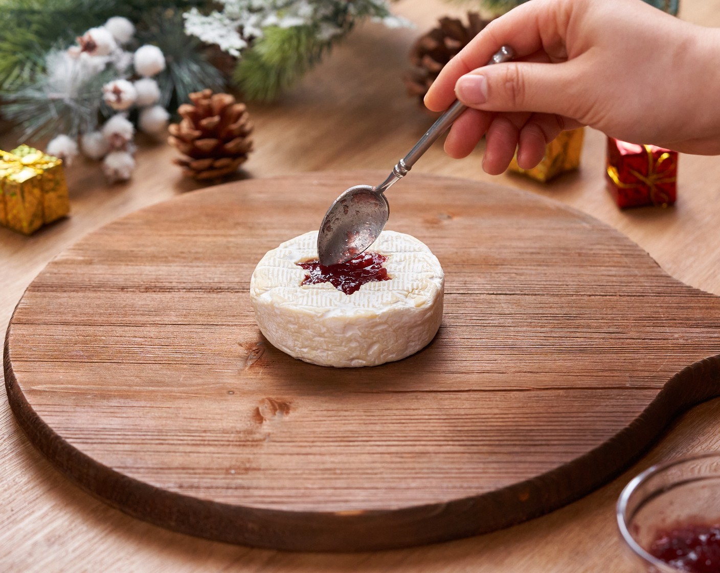 step 1 Cut a star shape in the middle of the Brie Cheese (1 pckg) with a cookie cutter, be careful not to cut all the way through. Remove the cutout part, and fill it up with Cranberry Sauce (2 Tbsp), set aside.