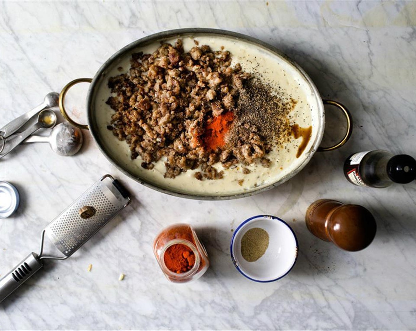 step 15 Season with Ground Black Pepper (1 Tbsp), Ground White Pepper (1 1/4 tsp), Worcestershire Sauce (1/2 tsp), Cayenne Pepper (1/2 tsp) and Ground Nutmeg (1/4 tsp). Simmer for 6 to 8 minutes. Re-season with salt if needed.