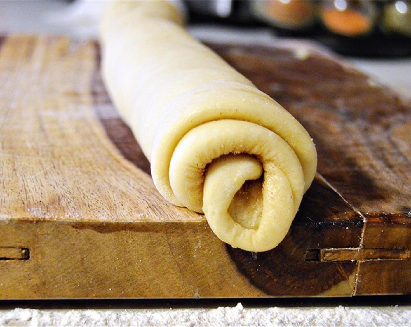 step 4 Roll dough tightly lengthwise. Cut into twelve sections. Place rolls in greased 9x13 pan. Cover and allow to rise for 30 minutes.