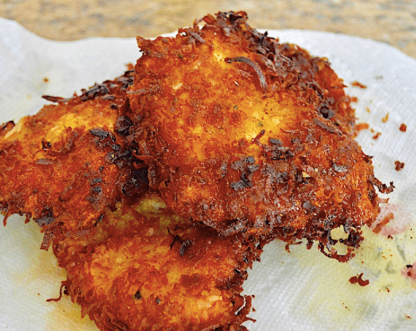 step 6 Finally, switch back to the first hand to coat them in the coconut mixture. When all four are breaded, get them into the hot oil to fry for 4-5 minutes on each side.