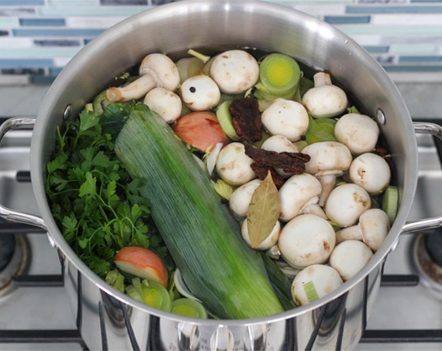 step 5 Fill the stockpot with water all the way to the top, leaving just enough room for the broth to simmer and not boil over.