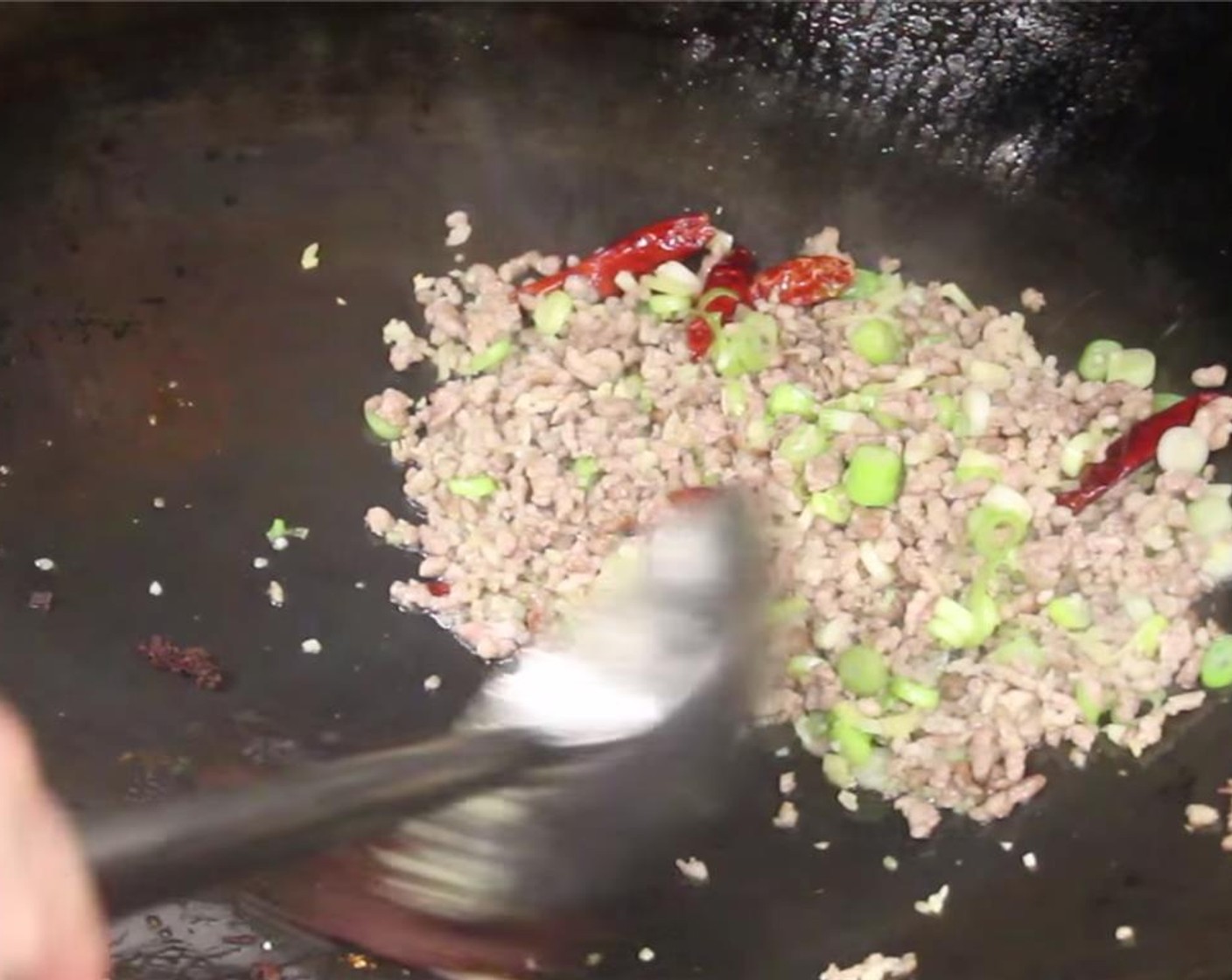 step 18 Add in the green onions, garlic and ginger. Saute until fragrant.