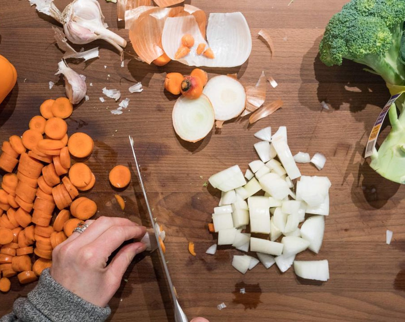 step 1 In a large sauce pan, sauté the White Onion (1) and Carrots (4) for a few minutes in Extra-Virgin Olive Oil (1 Tbsp).