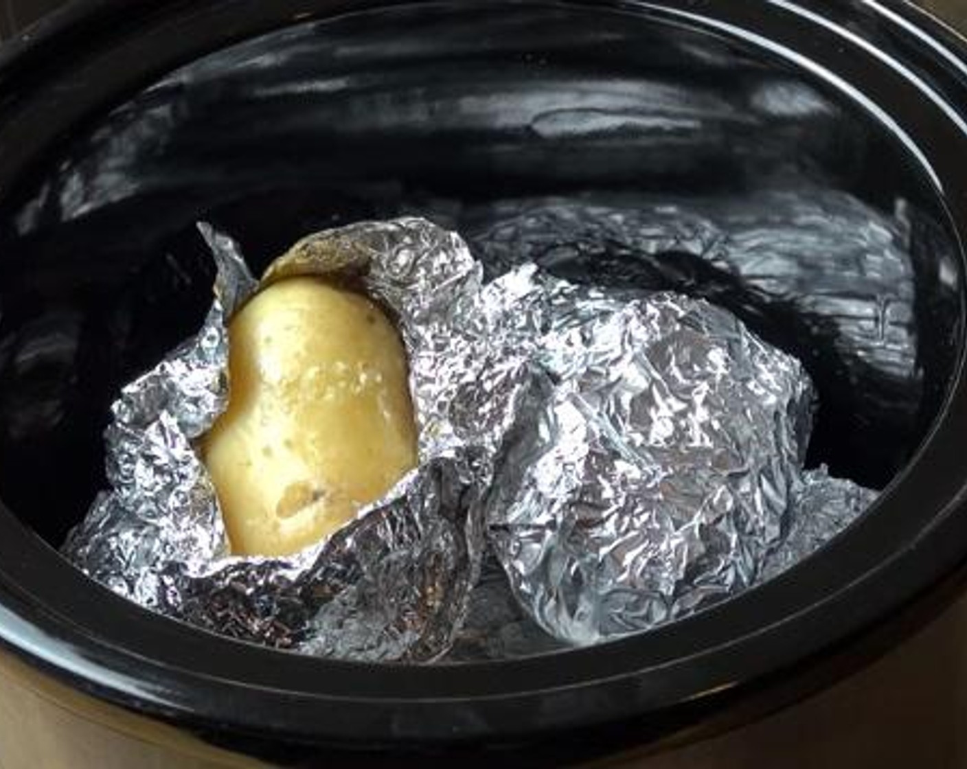 step 3 Place the potatoes into the slow cooker, and cook them for about 7 hours.