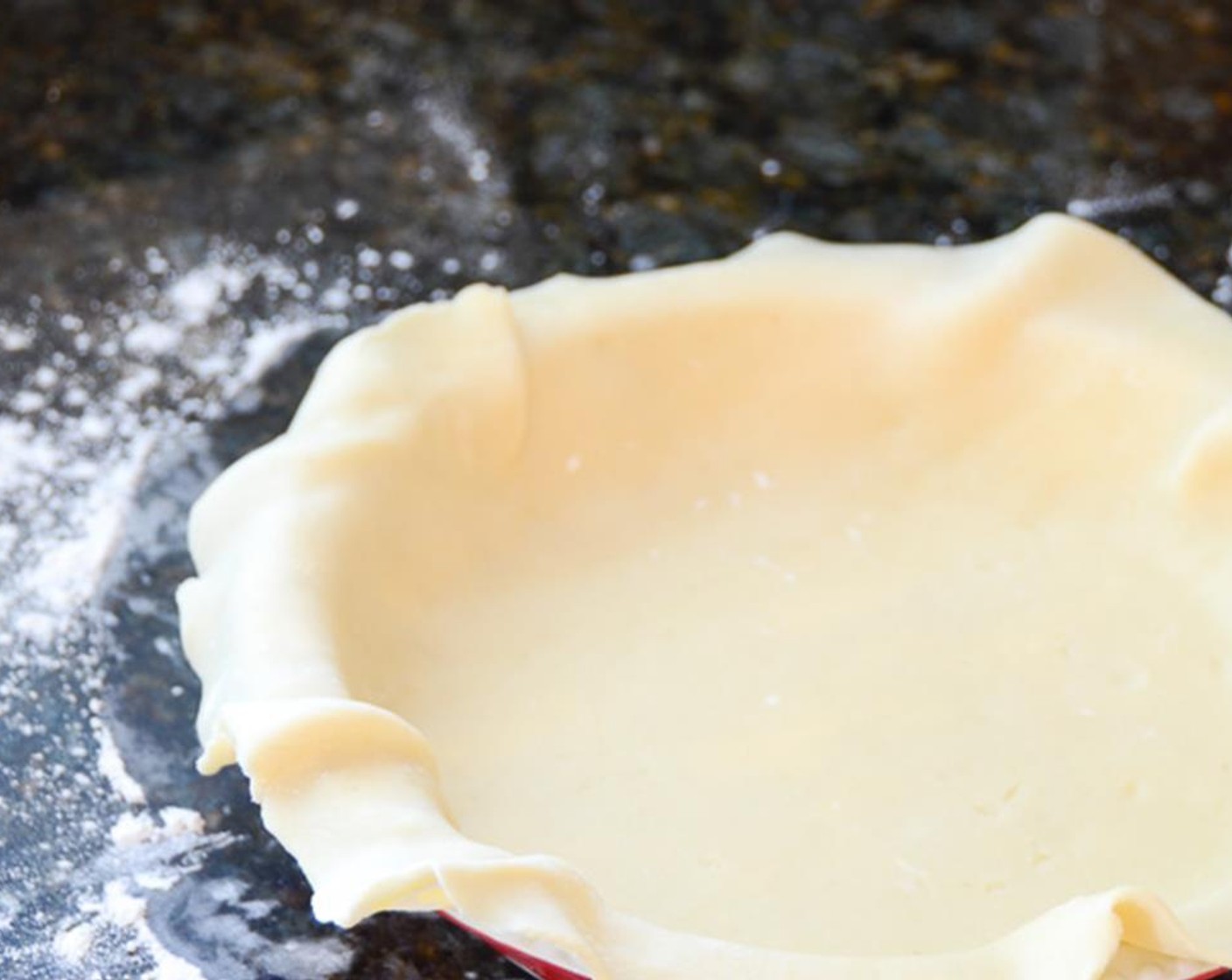 step 2 Lightly flour your work surface and roll one disc of the Pie Crusts (2) into a 12 inch circle. Fit it into a 9" pie plate and let the excess hang over the sides. Loosely cover with plastic wrap and refrigerate for 30 minutes -- until dough is firm.