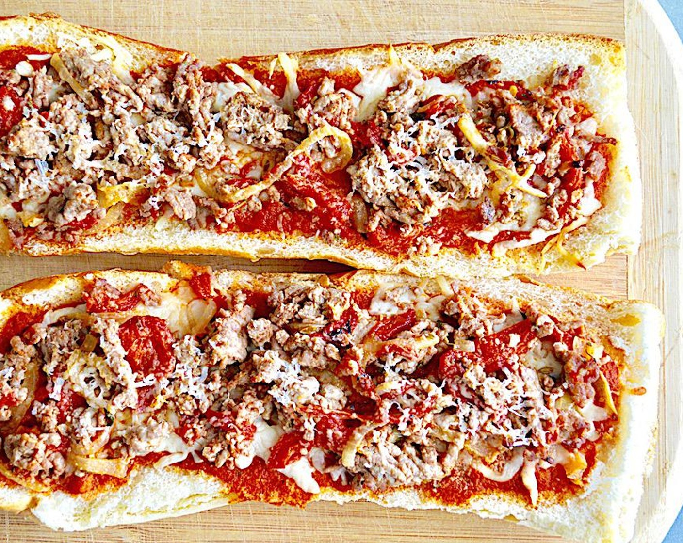 step 6 Evenly distribute the sausage mixture on top of the mozzarella on each crust. Finish it off by sprinkling a tablespoon of Asiago Cheese (1/4 cup) on top of each pizza. Bake them for about 20 minutes, until bubbly. Serve them immediately and enjoy!