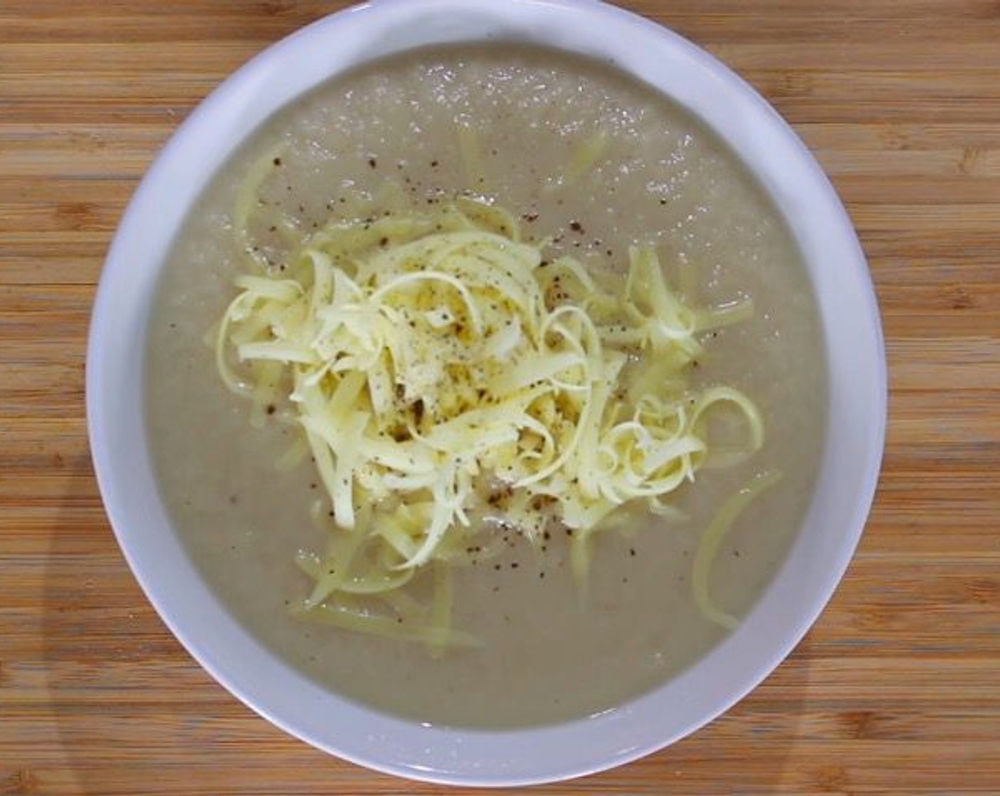 step 6 To serve, sprinkle soup with Extra Sharp Cheddar Cheese (1 cup) and Freshly Ground Black Pepper (to taste). Serve alongside crusty bread. Enjoy!