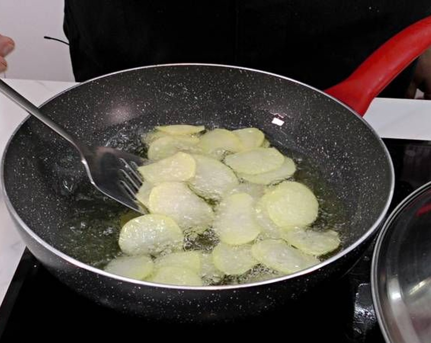 step 3 Heat Frying Oil (as needed) in a frying pan over medium heat. Once hot, fry the potato chips until golden brown.