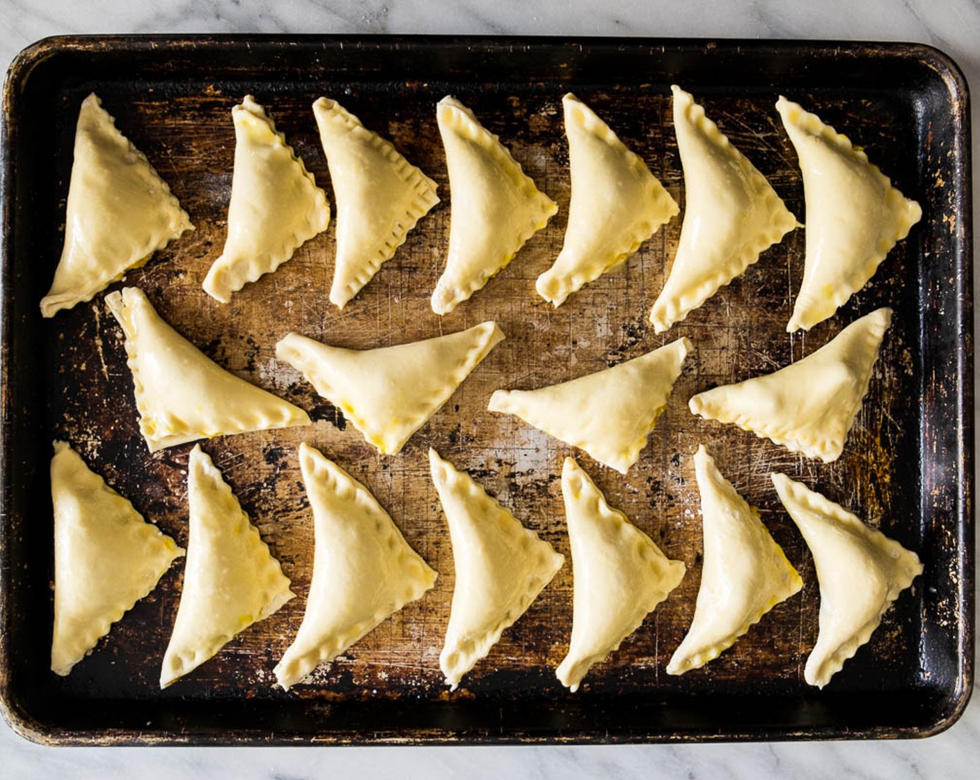 step 12 When the puffs are chilled, gently brush with a thin layer of egg wash. Transfer into the oven immediately. Bake for 15 to 18 minutes, or until golden brown.