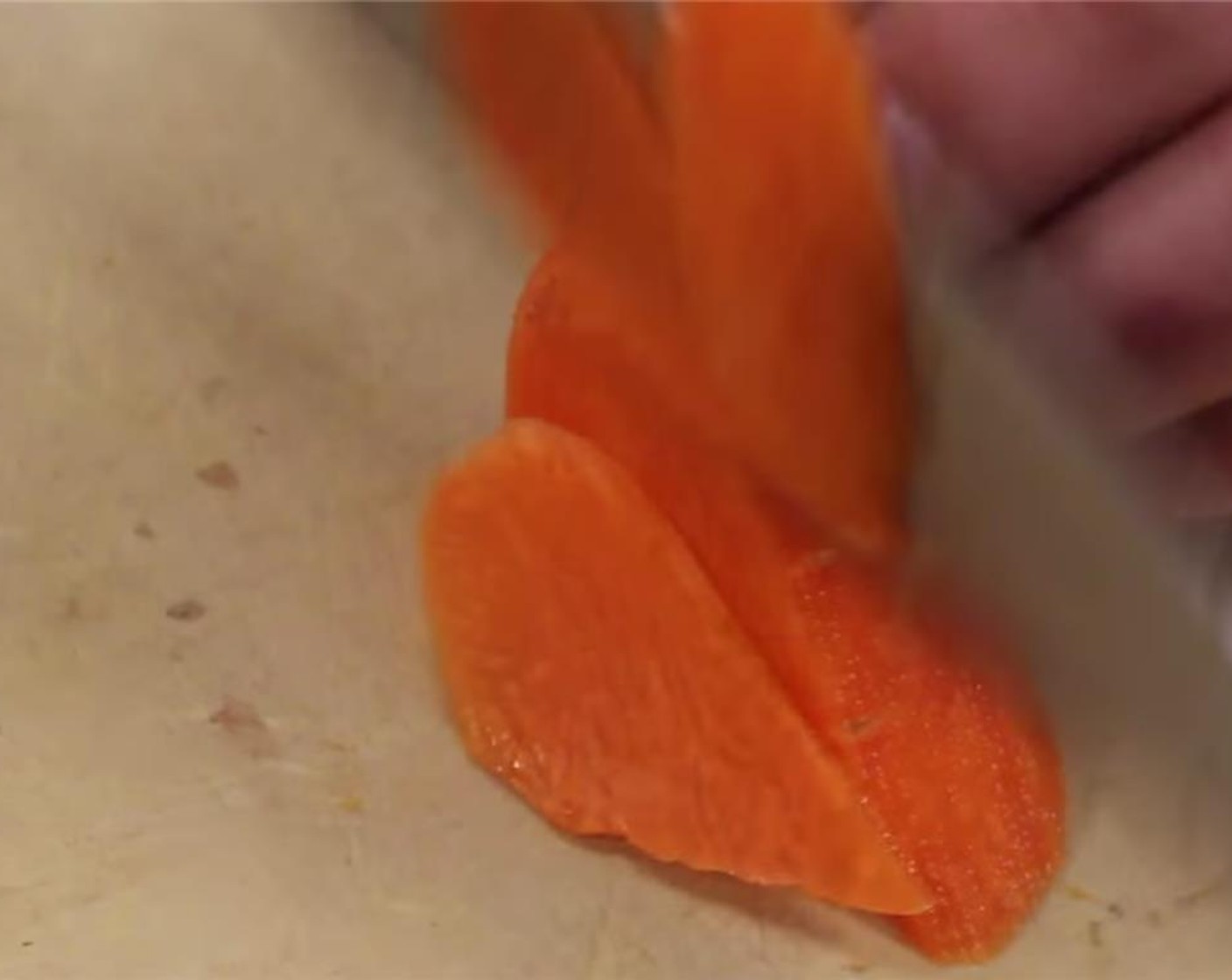 step 2 Cut a small portion of a Carrots (3 Tbsp) or about 1-inch piece. Slice the small portion into thin slices.