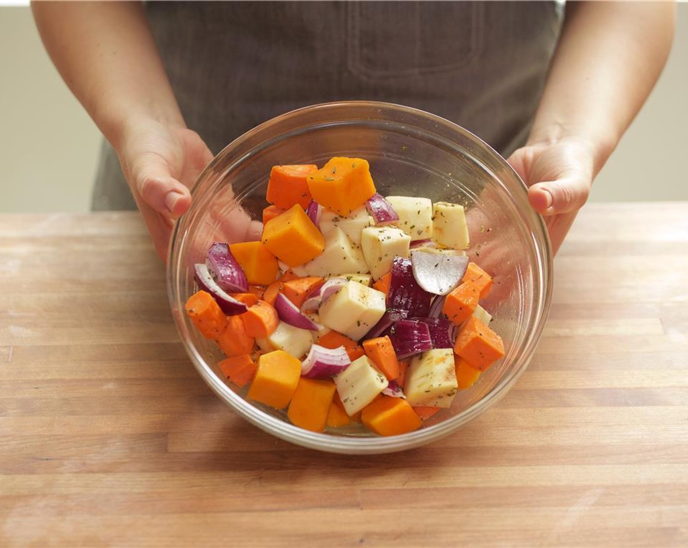 step 7 To the bowl with the vegetables, add the butternut squash cubes, fresh rosemary, Extra-Virgin Olive Oil (1 Tbsp), Salt (1/4 tsp), and Ground Black Pepper (1/4 tsp). Mix to combine.