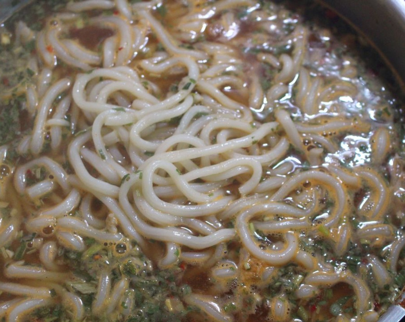 step 7 Add the fresh-cooked Udon Noodles (to taste) to the broth, check and adjust your seasoning, – if necessary, add Togarashi Chili (to taste) for some extra heat.