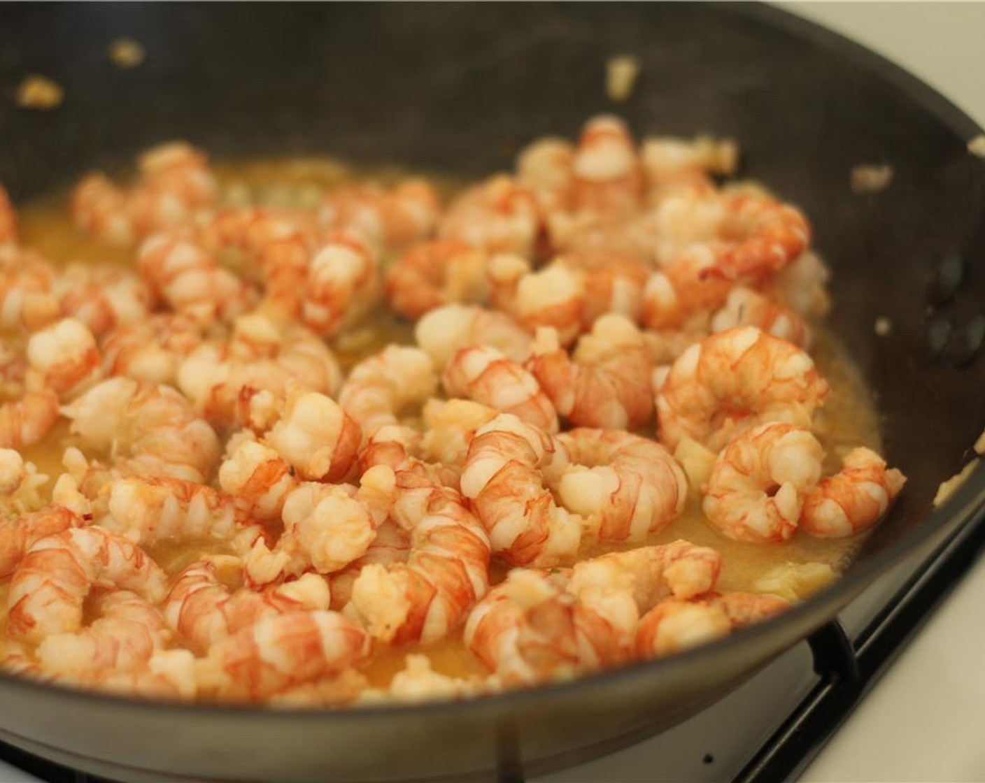 step 6 Add the shrimp to the pan and cook for about 5 minutes or until all the shrimp are no longer translucent. Set aside.