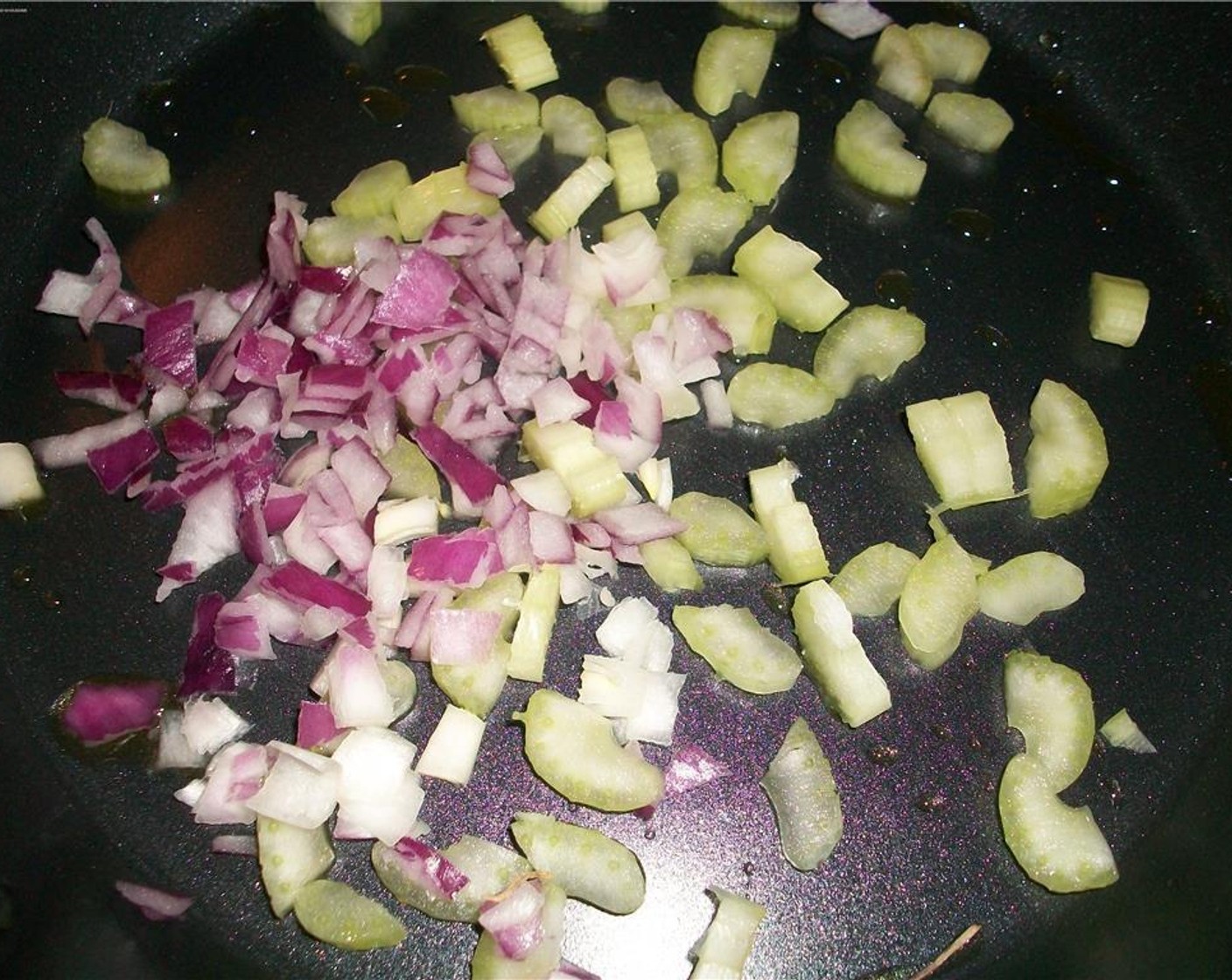 step 6 In a frying pan, saute the chopped celery and chopped onion in a small amount of Olive Oil (to taste).