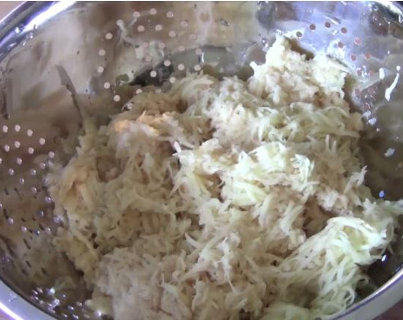 step 1 Run your Potatoes (2.2 lb) through a cheese grater. Remove the excess liquid and transfer into a separate bowl.