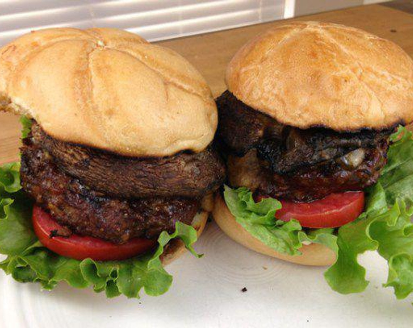 step 5 Once the burger has grilled for a total of 16 minutes, it is time to assemble this Grilled Portabella Burger. Start with Hamburger Buns (2) then add the Mayonnaise (to taste), Lettuce Leaves (2), Tomatoes (2) and top with grilled portabella burgers.