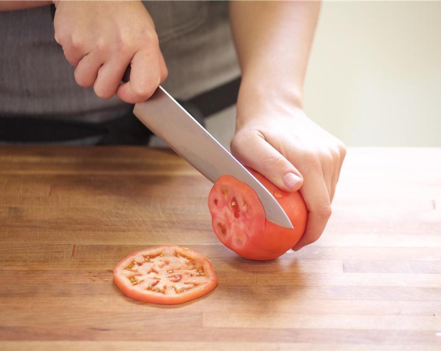 step 1 Preheat grill to medium-high heat. Slice Tomato (1) into half-inch sliced rounds and set aside. Peel and cut Red Onion (1/2) into quarter-inch sliced rounds and set aside. Slice Romaine Lettuce (2 pieces) in half widthwise and set aside.