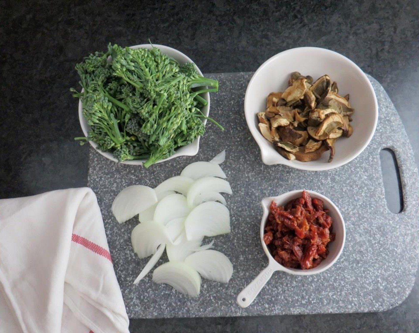 step 1 Reconstitute and roughly chop the Dried Porcini Mushroom (1 cup). Drain and thinly slice the Sun-Dried Tomatoes in Olive Oil (1 cup). Trim the root from the Onion (1/2) and slice lengthwise. Cut the Broccoli Florets (2 cups).