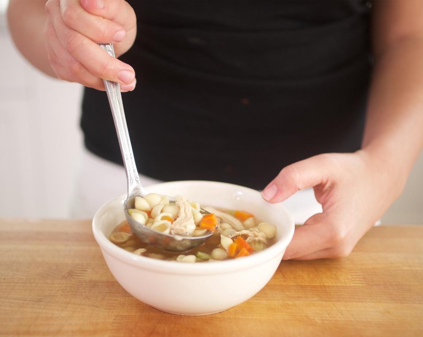 step 10 Ladle chicken soup into two bowls with equal portions. Serve with the baguette on the side. Enjoy!