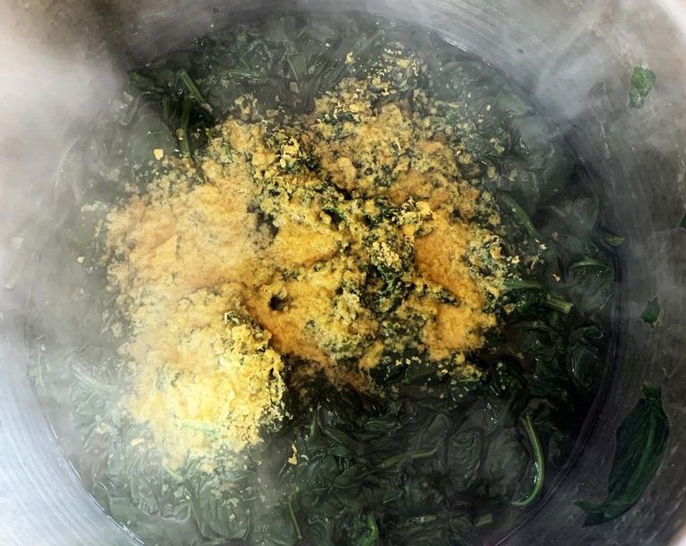 step 2 Cover with a lid and bring to a boil, cook on low heat simmering for about 15-20 min or until the spinach is soft. Add the Nutritional Yeast (2 Tbsp).