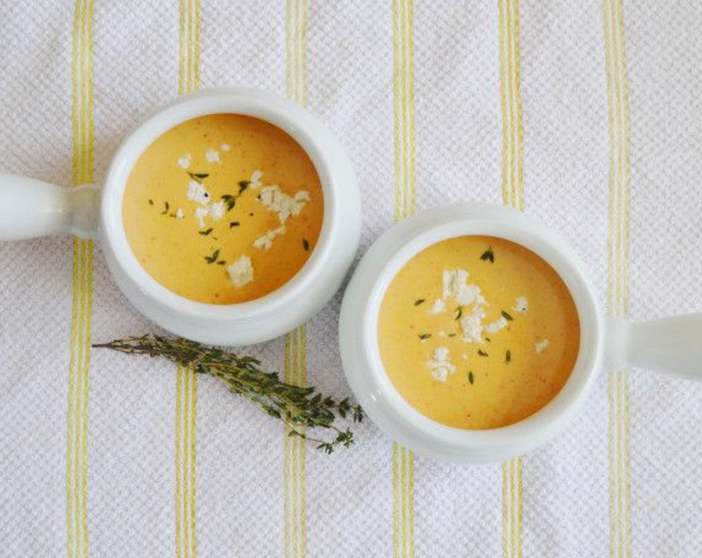 step 8 Once the soup is pureed, ladle it into pretty bowls or crocks and add a little Goat Cheese (to taste) for extra creaminess. Top with a sprinkle of Fresh Thyme Leaves (to taste) and serve immediately while hot!