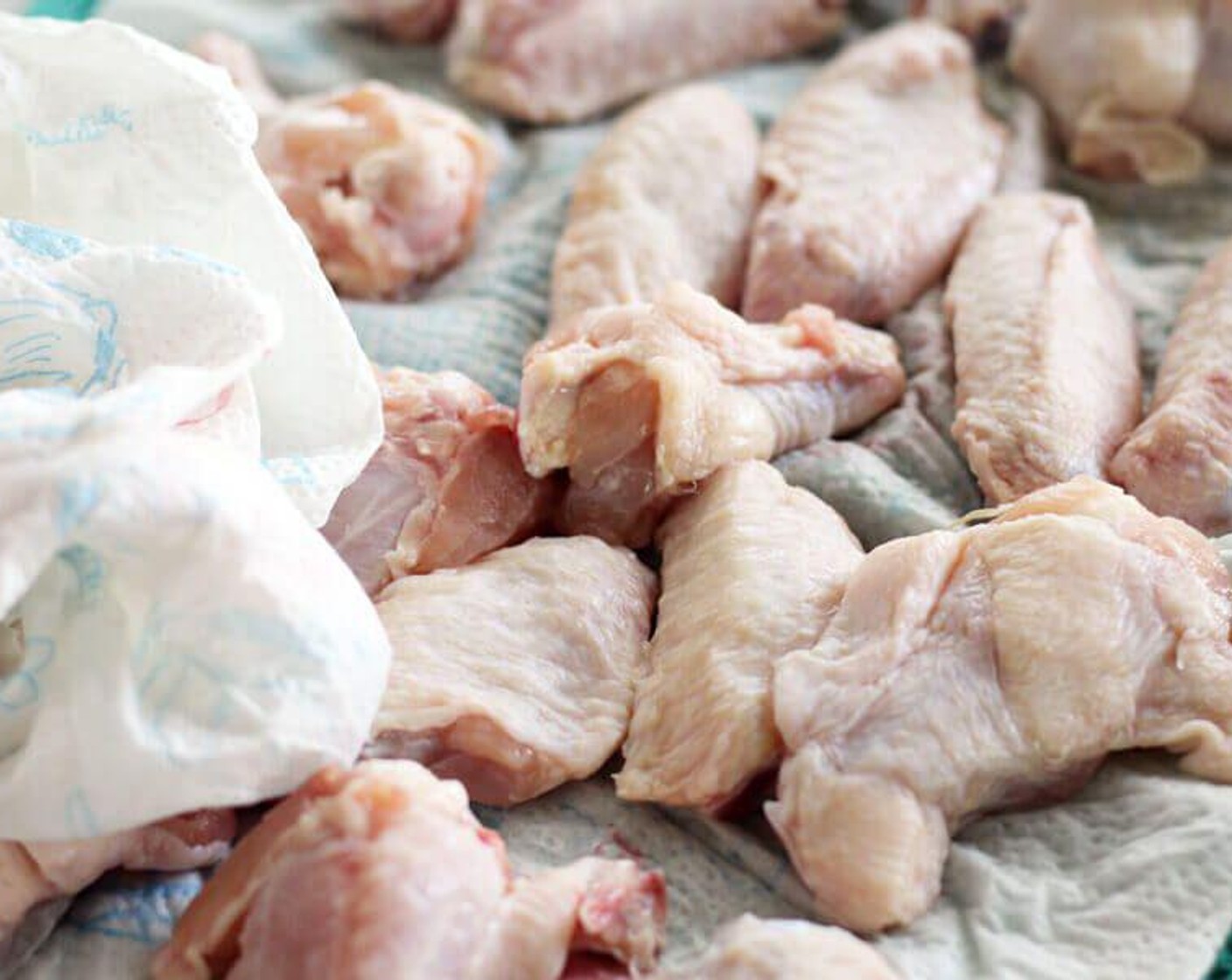 step 2 Rinse and pat dry the Chicken Wings (3 lb) with paper towels. Sprinkle lightly on both sides with Salt (1/2 tsp) and Ground Black Pepper (1/2 tsp).