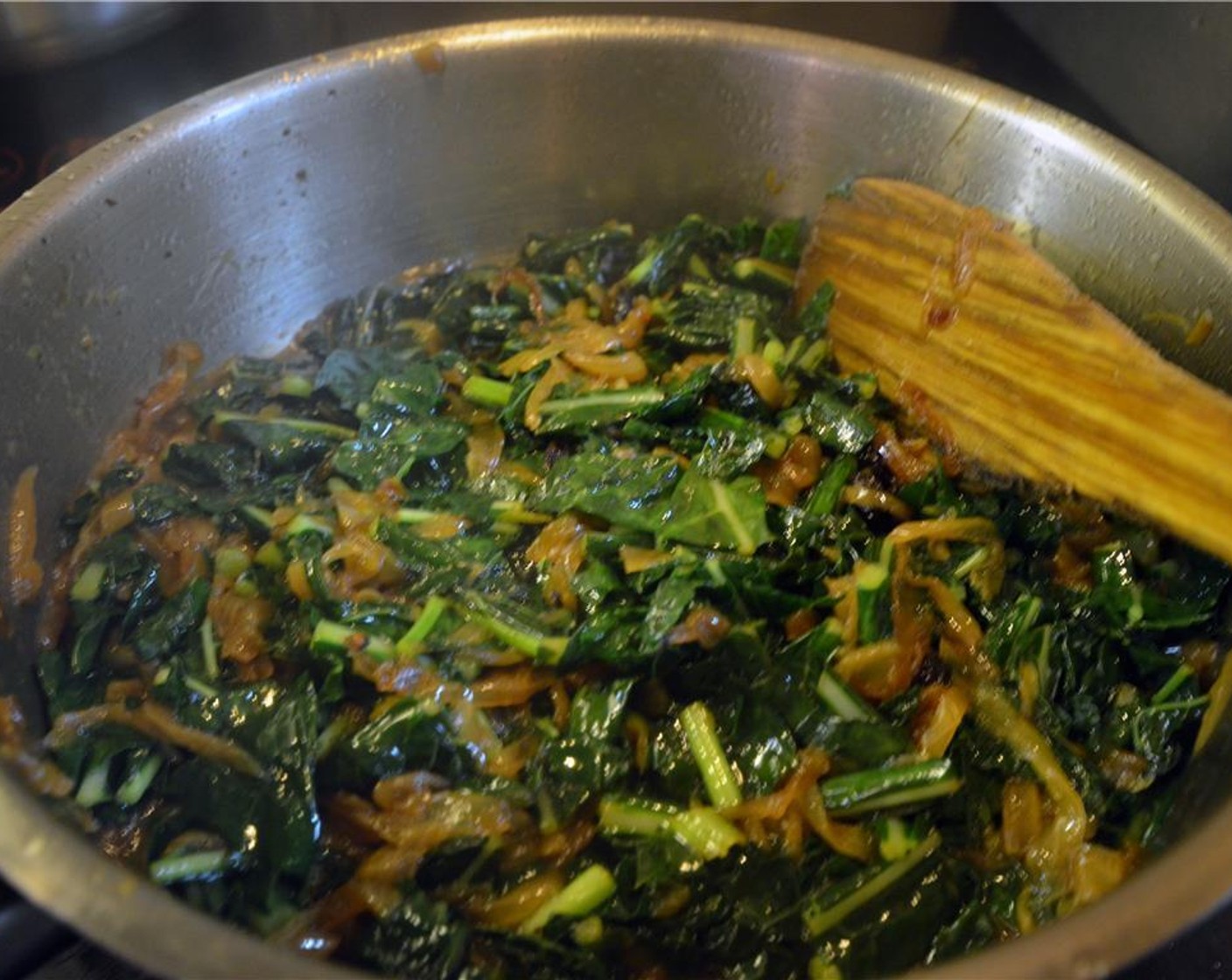 step 9 When the kale releases its moisture, add the Raisins (1/3 cup) and continue to cook for 30 minutes to an hour, until the kale is quite tender.