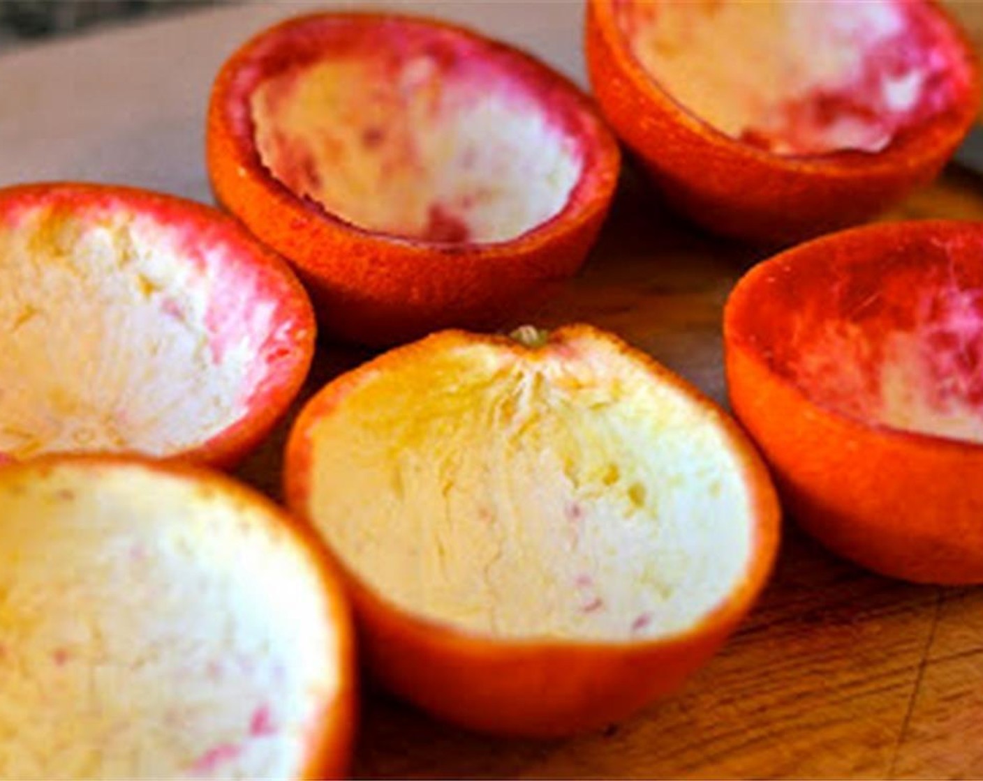 step 1 Slice 5 blood oranges in half and carefully remove the fruit portion to make orange peel “cups.”