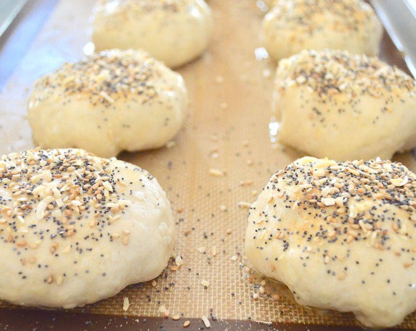 step 7 Then stir the Poppy Seeds (1 tsp), Sesame Seeds (1 tsp), Dried Onions (1 tsp) and McCormick® Garlic Powder (1 tsp) together and sprinkle each bomb generously with that mixture to mimic an everything bagel.
