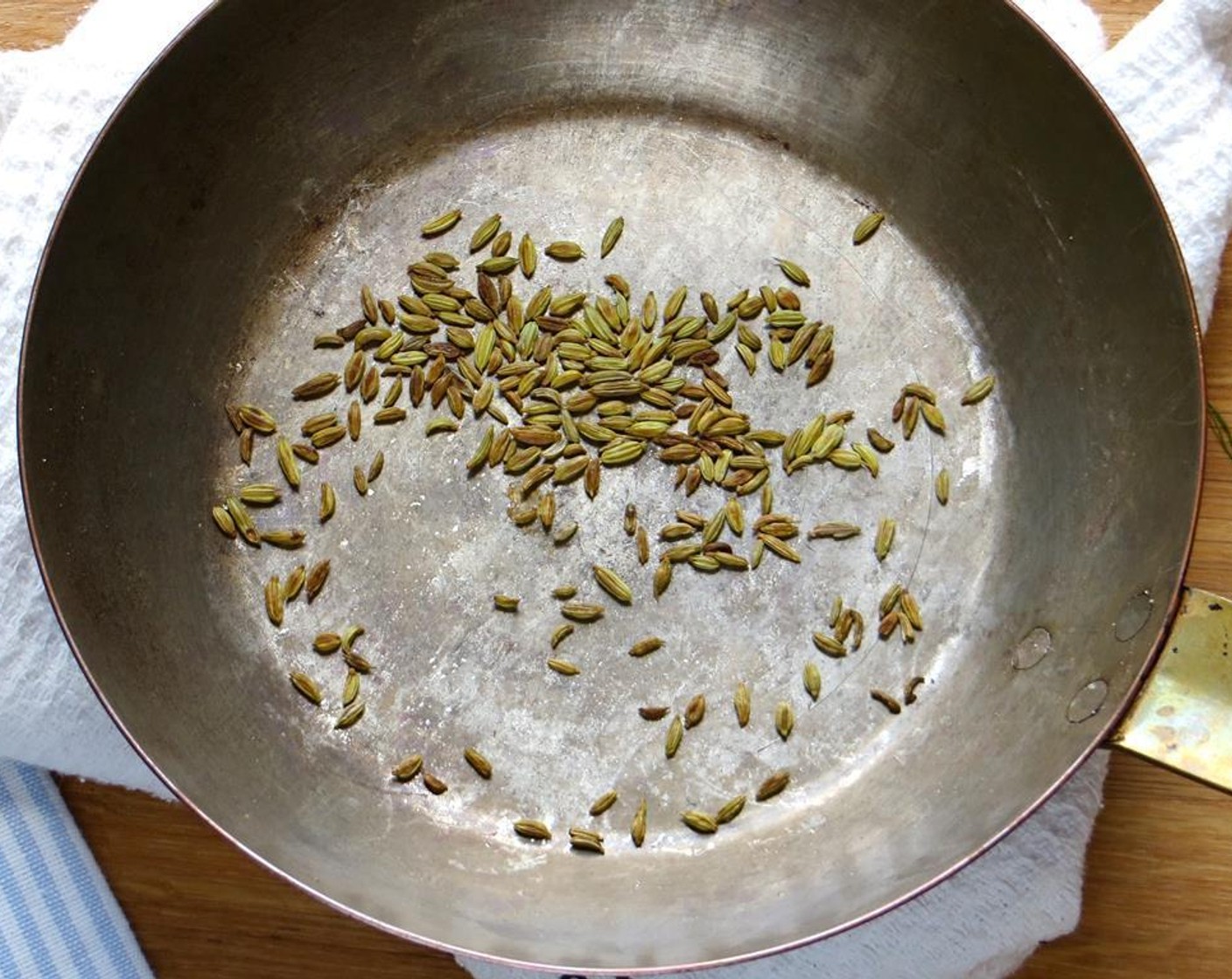 step 7 In a small skillet, toast the Fennel Seeds (1 tsp) until warm, fragrant, and beginning to pop. Remove from heat and use a mortar and pestle, spice grinder or a heavy rolling pin to crush the seeds.
