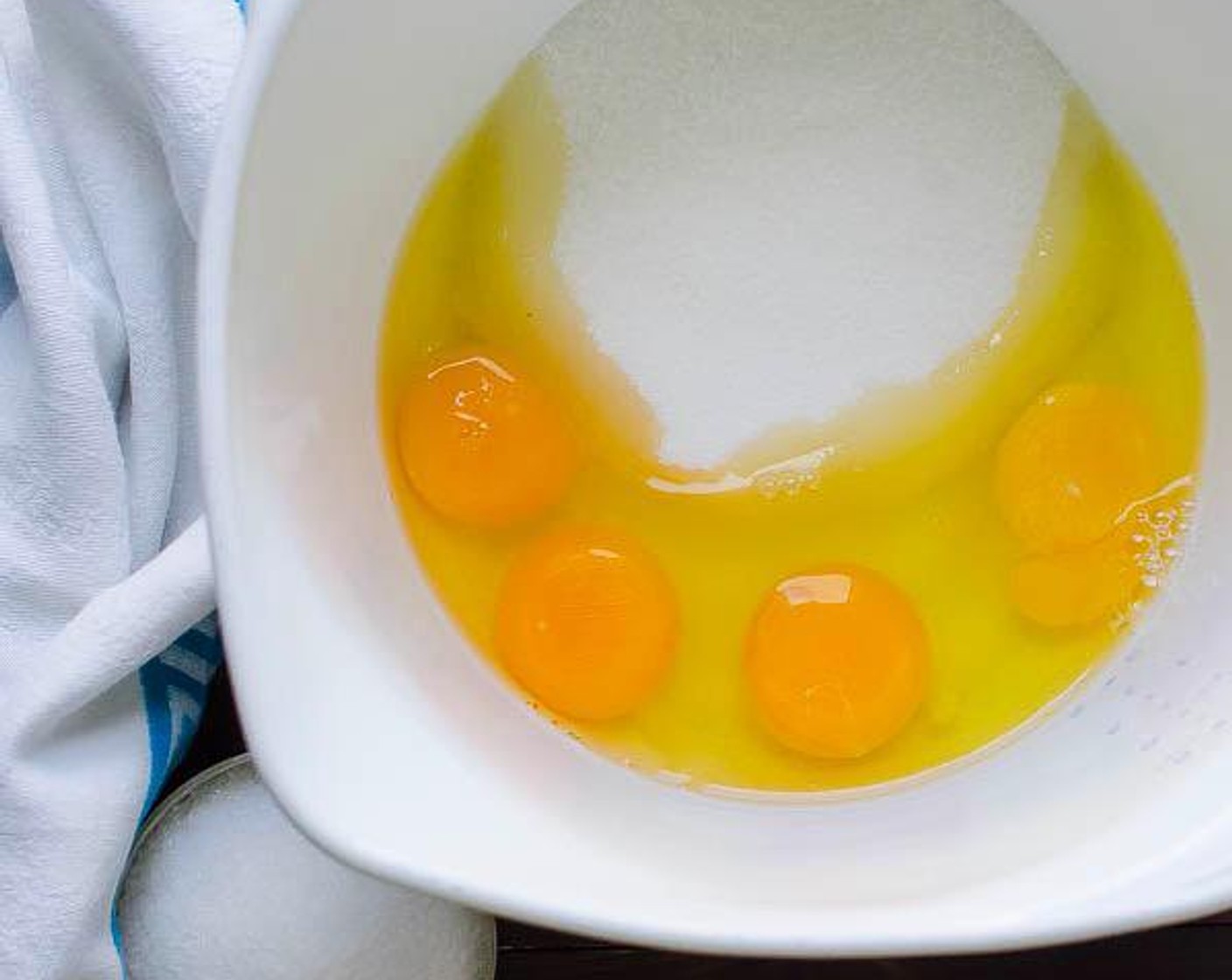 step 2 In a large mixing bowl, combine Eggs (4) and Granulated Sugar (1 1/2 cups). Blend on medium speed for about 5 minutes until thick and light-colored.