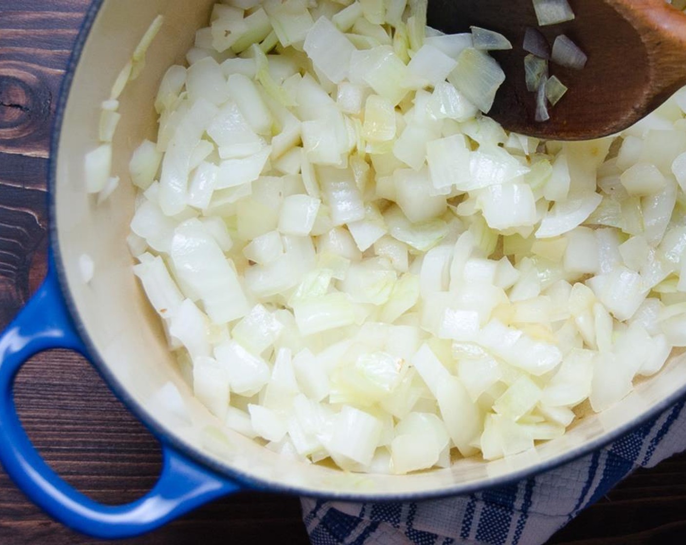 step 1 In a large dutch oven, heat Olive Oil (2 Tbsp) over medium high heat. Chop the Onion (1). Add onions and sauté until softened and slightly translucent.