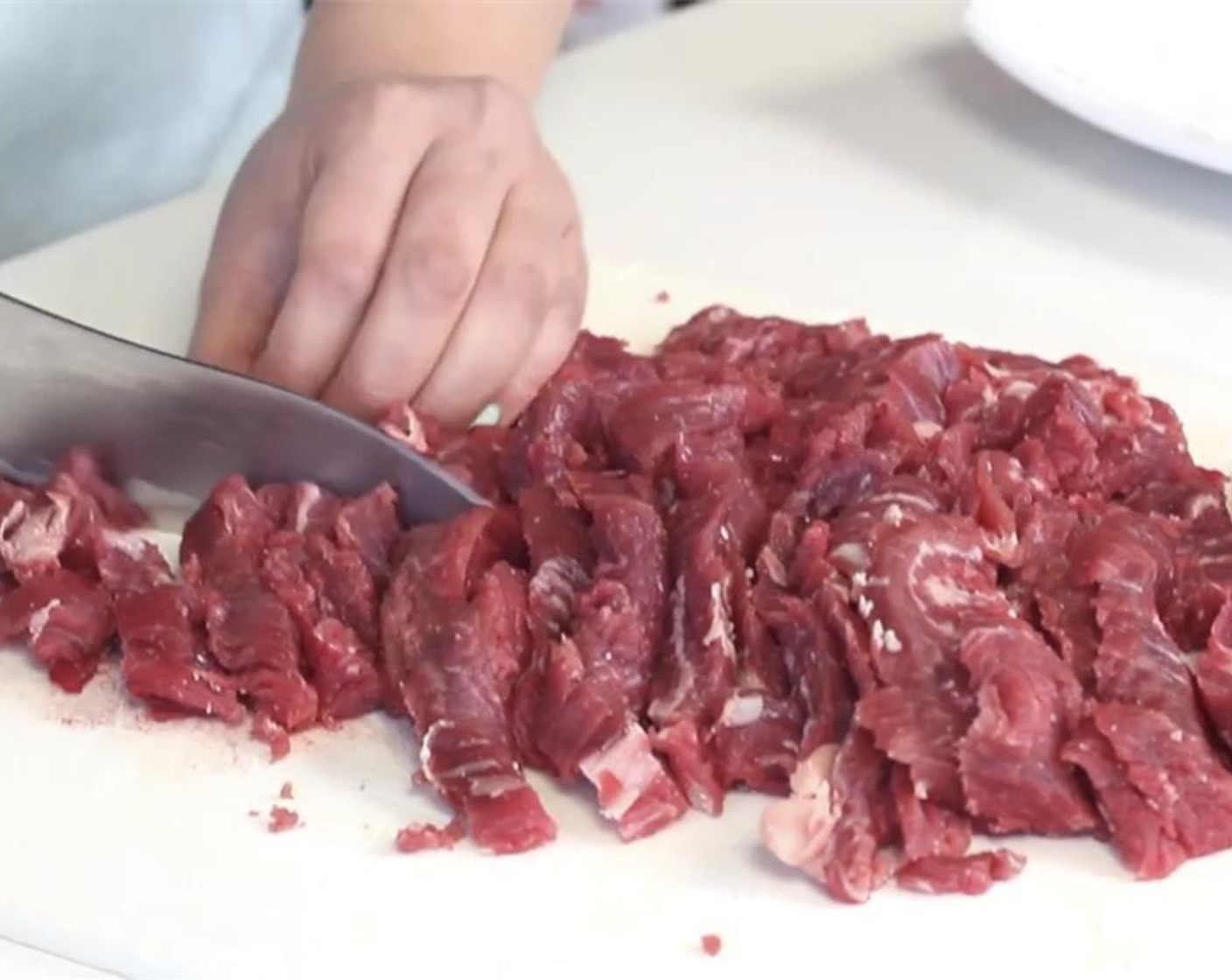 step 2 If your steak slices are really long, cut them down into about 3 inch pieces. Pat the pieces of steak dry with a paper towel.